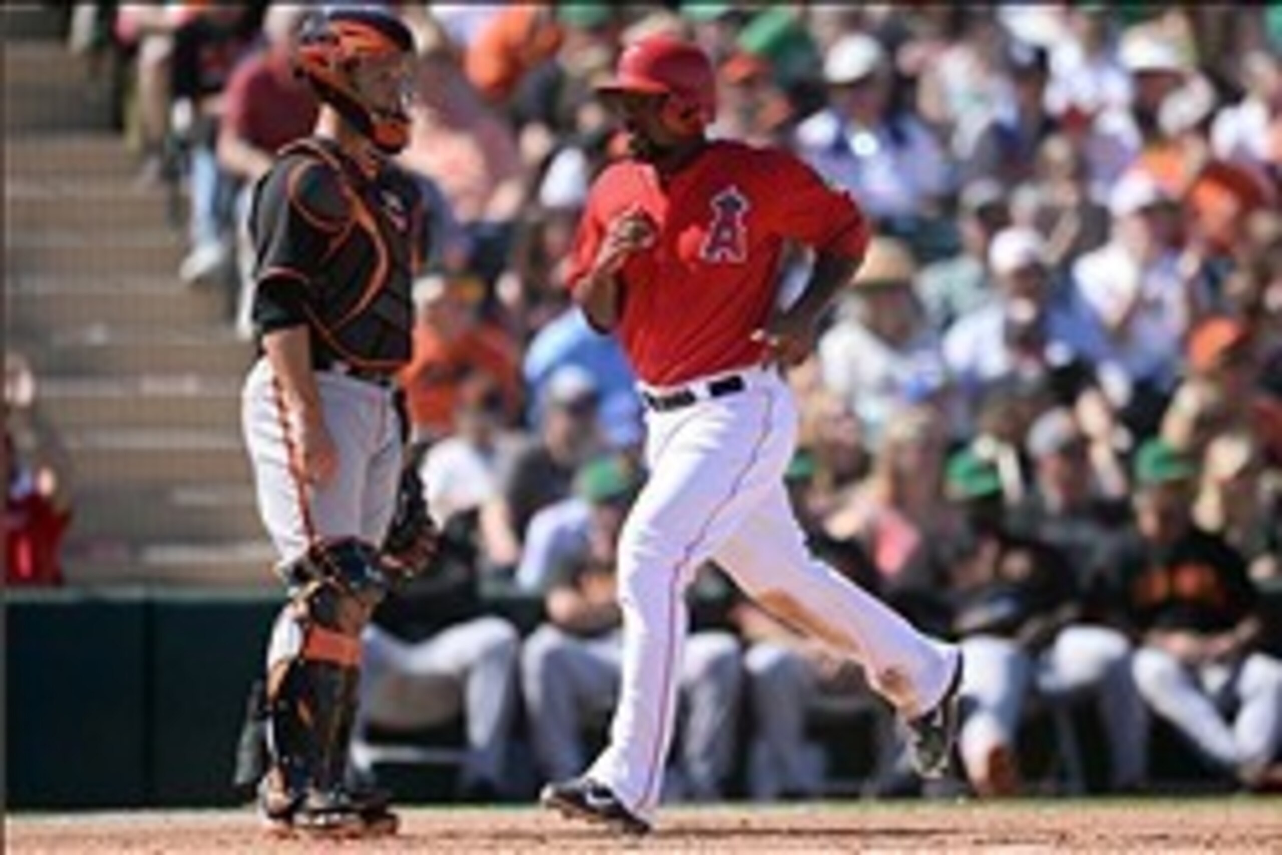 Mar 17, 2014; Tempe, AZ, USA;  Los Angeles Angels second baseman Howie Kendrick (47) scores a run in the fourth inning against the San Francisco Giants at Tempe Diablo Stadium. Mandatory Credit: Joe Camporeale-USA TODAY Sports