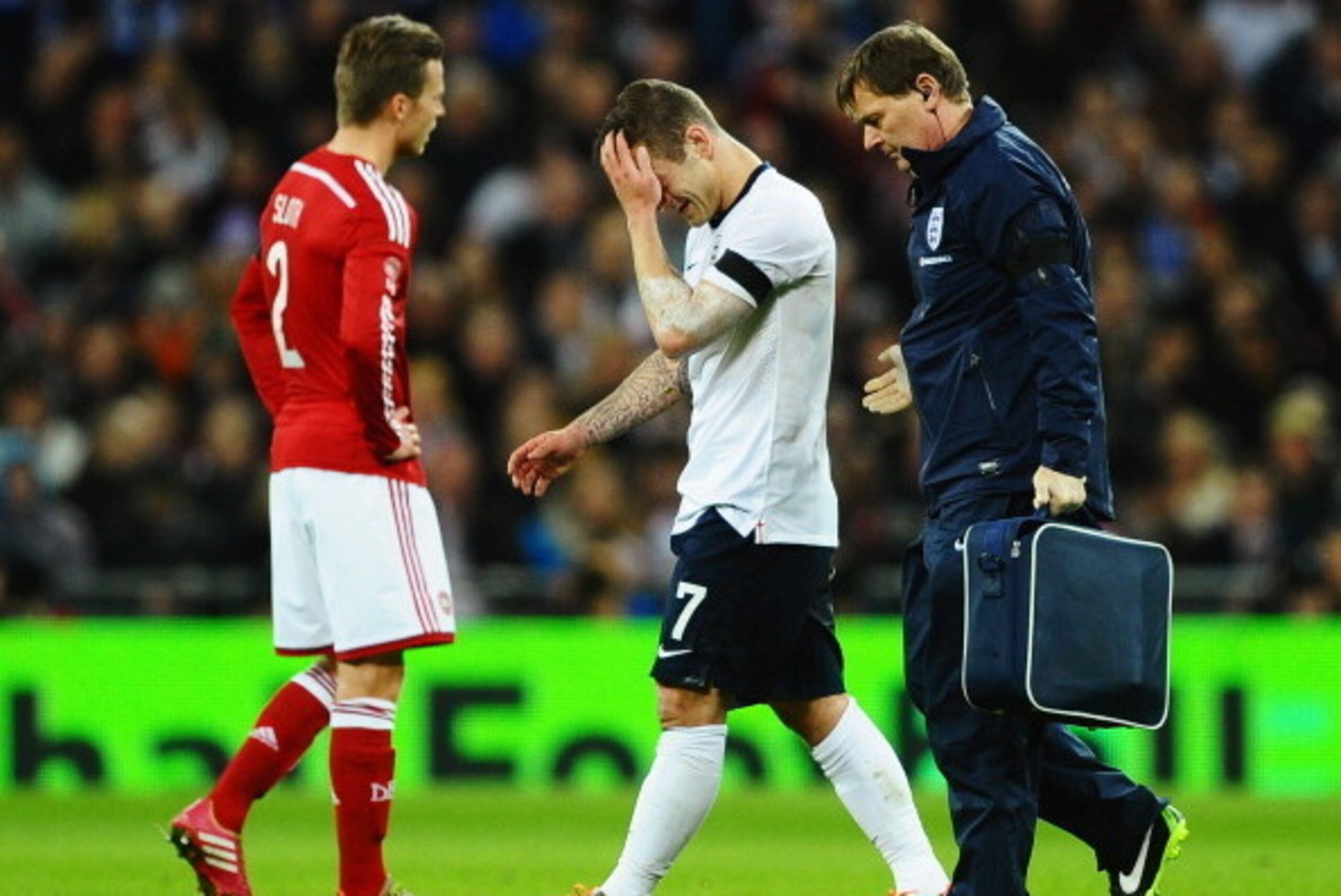 LONDON, ENGLAND - MARCH 05:  Jack Wilshere of England leaves the field after receiving treatment during the International Friendly match between England and Denmark at Wembley Stadium on March 5, 2014 in London, England.  (Photo by Laurence Griffiths/Gett
