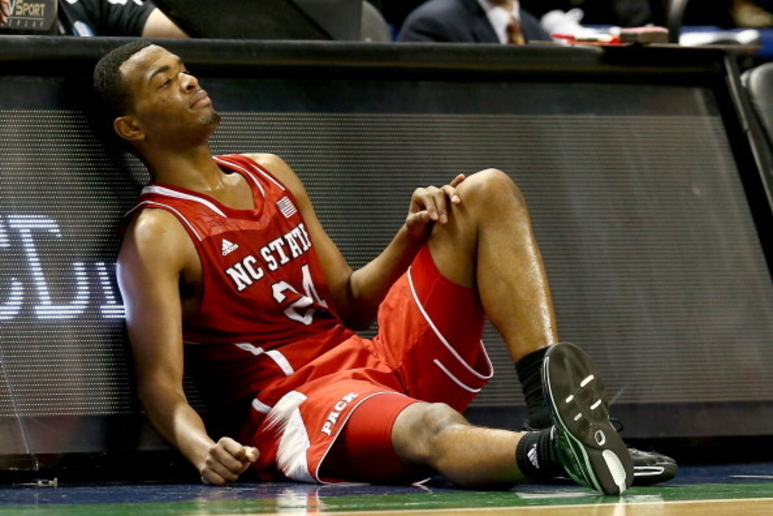 GREENSBORO, NC - MARCH 15:  T.J. Warren #24 of the North Carolina State Wolfpack falls on the sideline against the Duke Blue Devils during the semifinals of the 2014 Men's ACC Basketball Tournament at Greensboro Coliseum on March 15, 2014 in Greensboro, N