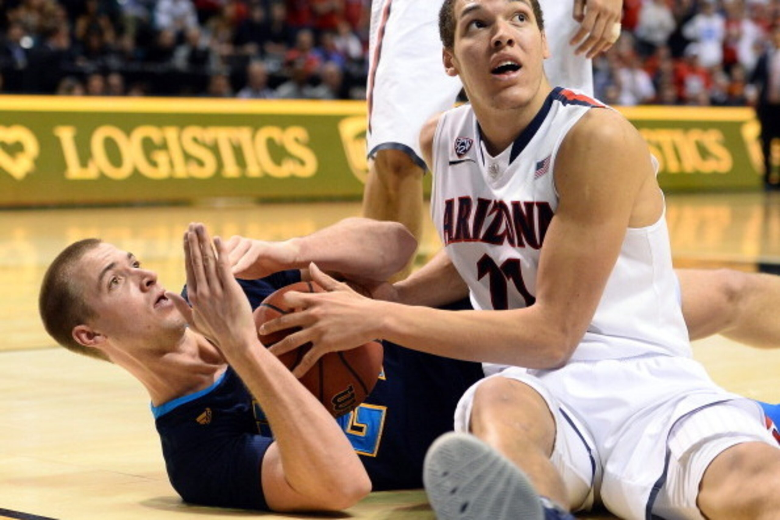 LAS VEGAS, NV - MARCH 15: Travis Wear #24 of the UCLA Bruins calls a timeout as he fights Aaron Gordon #11 of the Arizona Wildcats for a loose ball following a Bruins steal late in the championship game of the Pac-12 Basketball Tournament at the MGM Gran LAS VEGAS, NV - MARCH 15: Travis Wear #24 of the UCLA Bruins calls a timeout as he fights Aaron Gordon #11 of the Arizona Wildcats for a loose ball following a Bruins steal late in the championship game of the Pac-12 Basketball Tournament at the MGM Gran