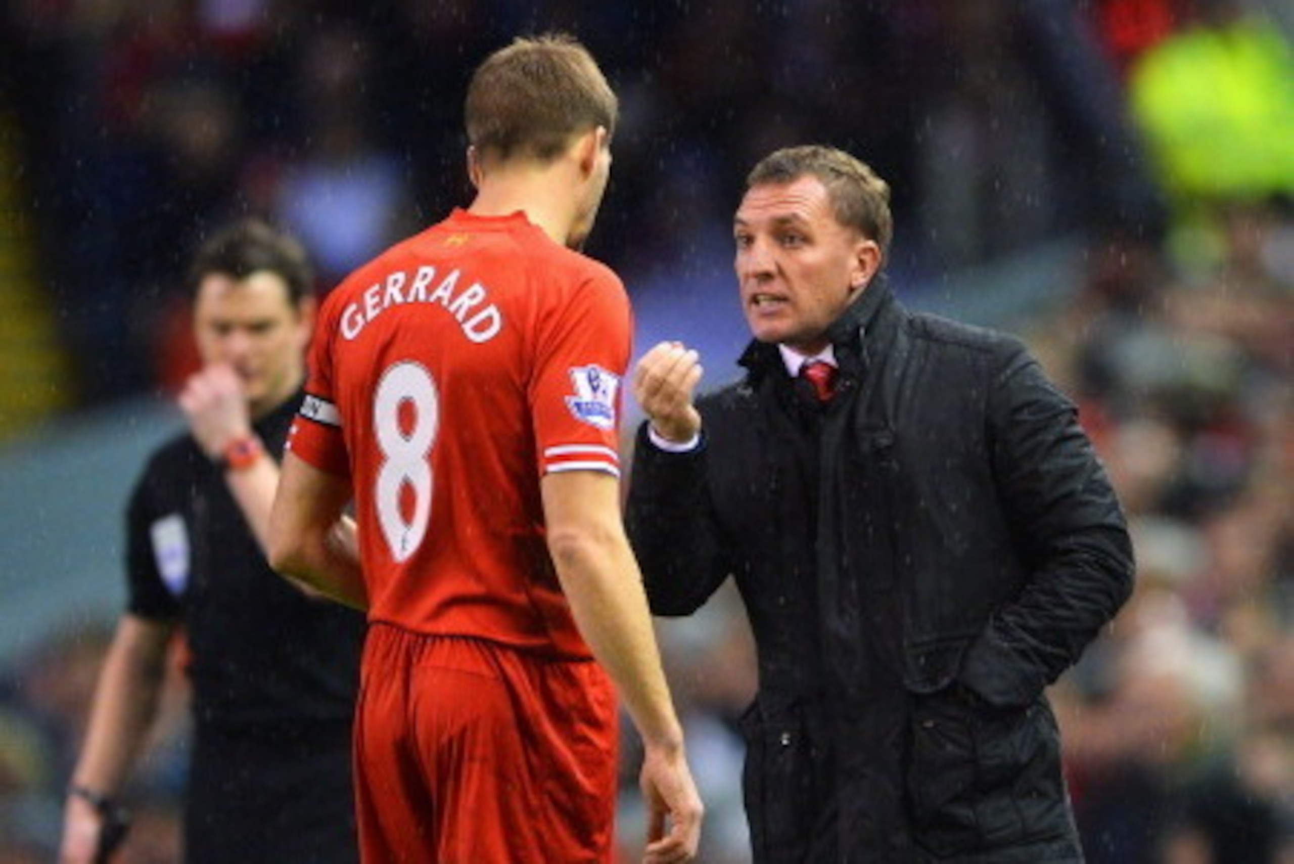 LIVERPOOL, ENGLAND - JANUARY 18: Brendan Rodgers, manager of Liverpool talks to Steven Gerrard during the Barclays Premier League match between Liverpool and Aston Villa at Anfield on January 18, 2014 in Liverpool, England.  (Photo by Michael Regan/Getty 