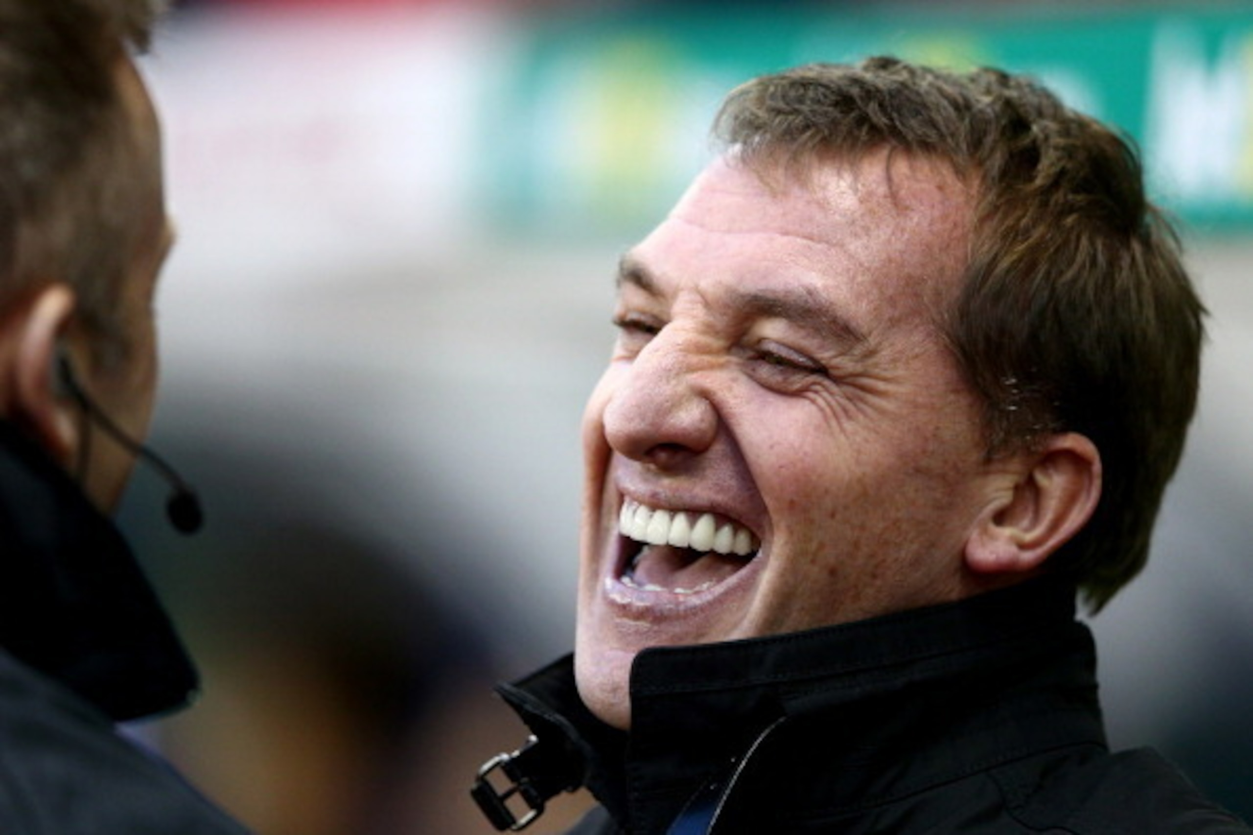 STOKE ON TRENT, ENGLAND - JANUARY 12:   Brendan Rodgers manager of Liverpool laughs prior to the Barclays Premier League match between Stoke City and Liverpool at Britannia Stadium on January 12, 2014 in Stoke on Trent, England.  (Photo by Clive Mason/Get