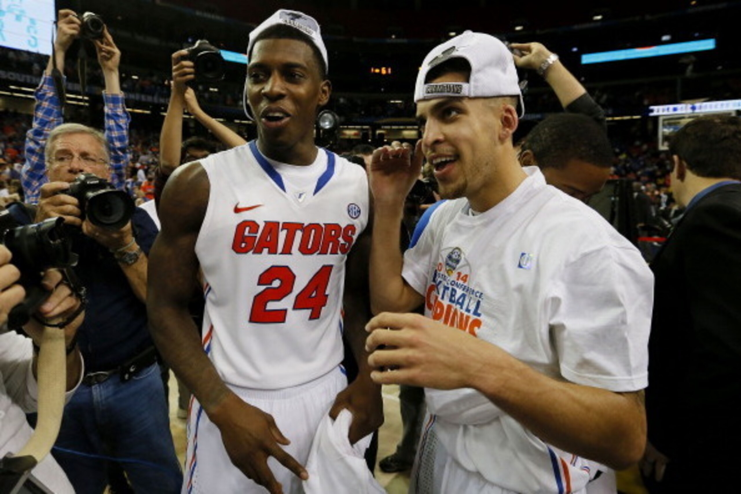 ATLANTA, GA - MARCH 16:  Casey Prather #24 and Scottie Wilbekin #5 of the Florida Gators celebrate their 61 to 60 win over the Kentucky Wildcats in the Championship game of the 2014 Men's SEC Basketball Tournament at Georgia Dome on March 16, 2014 in Atla