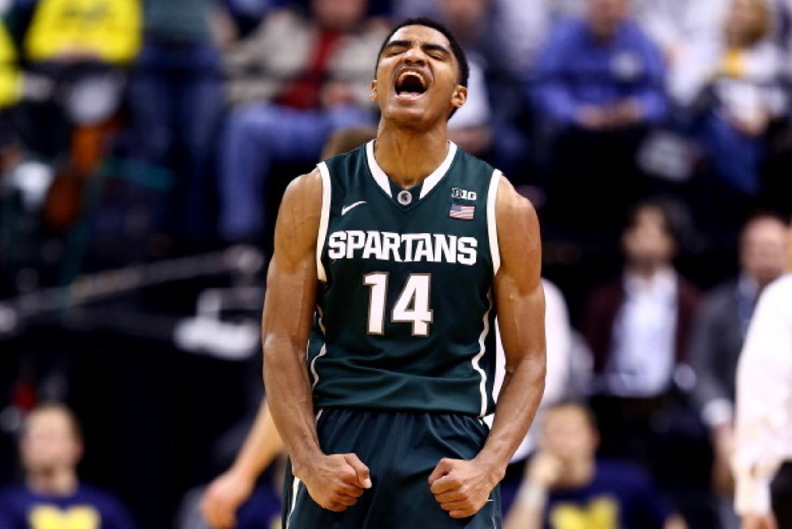 INDIANAPOLIS, IN - MARCH 16: Gary Harris #14 of the Michigan State Spartans reacts against the Michigan Wolverines during the 2014 Big Ten Men's Championship at Bankers Life Fieldhouse on March 16, 2014 in Indianapolis, Indiana.  (Photo by Andy Lyons/Gett