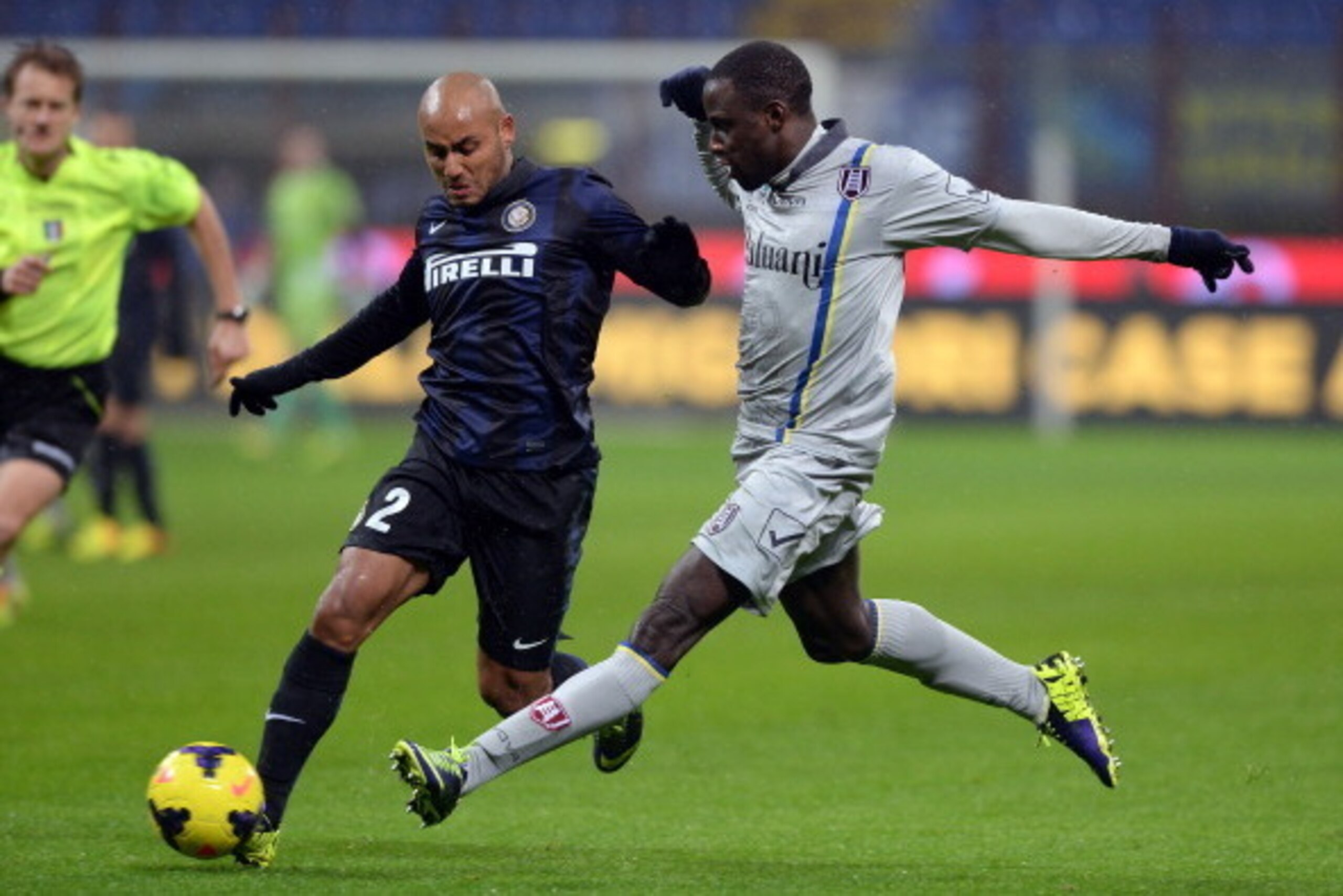 MILAN, ITALY - JANUARY 13:  Jonathan of FC Inter Milan (L) and Boukary Drame of AC Chievo Verona compete for the ball during the Serie A match between FC Internazionale Milano and AC Chievo Verona at San Siro Stadium on January 13, 2014 in Milan, Italy.  