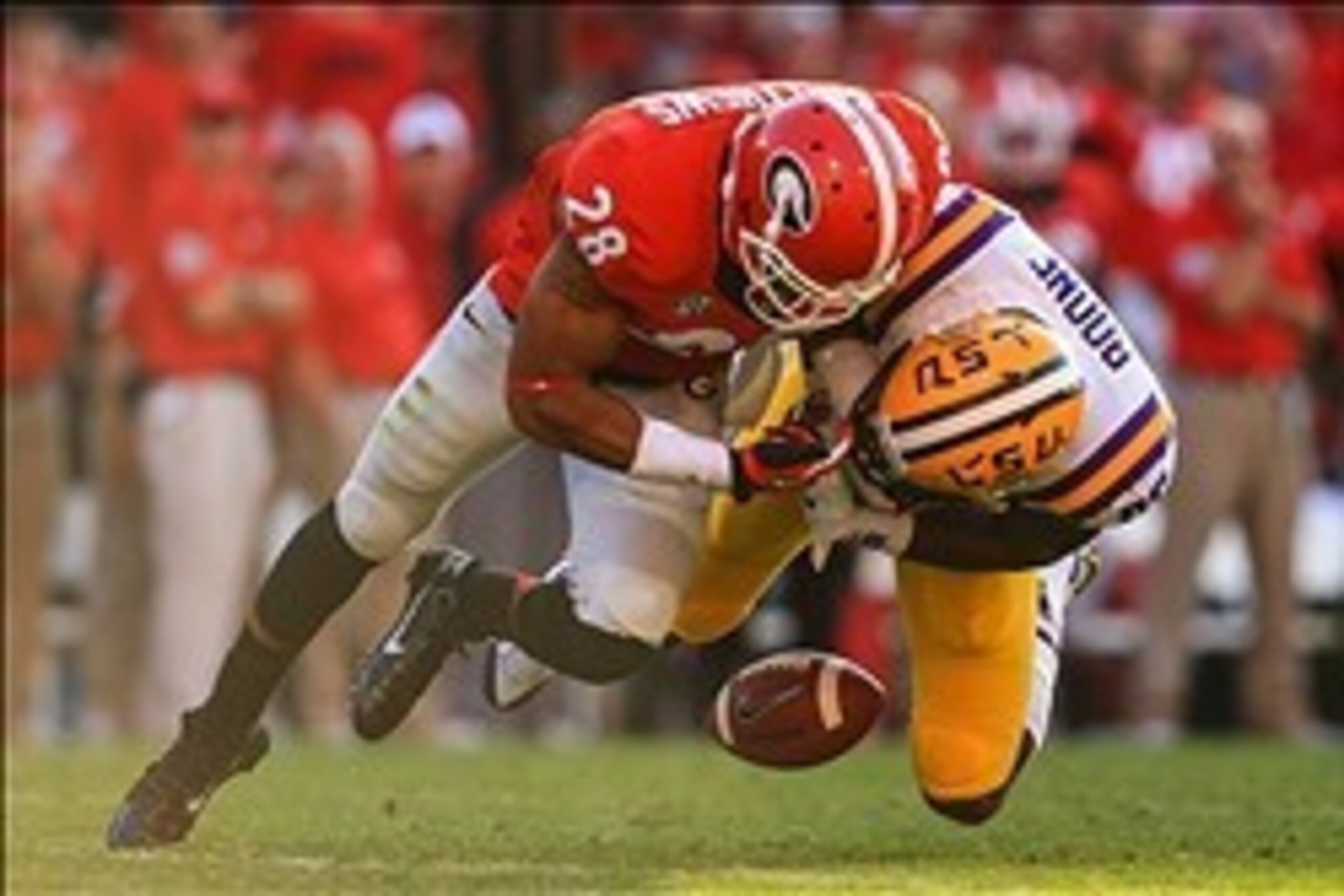 Sep 28, 2013; Athens, GA, USA; Georgia Bulldogs safety Tray Matthews (28) breaks up a pass intended for LSU Tigers wide receiver Kadron Boone (86) in the second half at Sanford Stadium. Georgia won 44-41. Mandatory Credit: Daniel Shirey-USA TODAY Sports