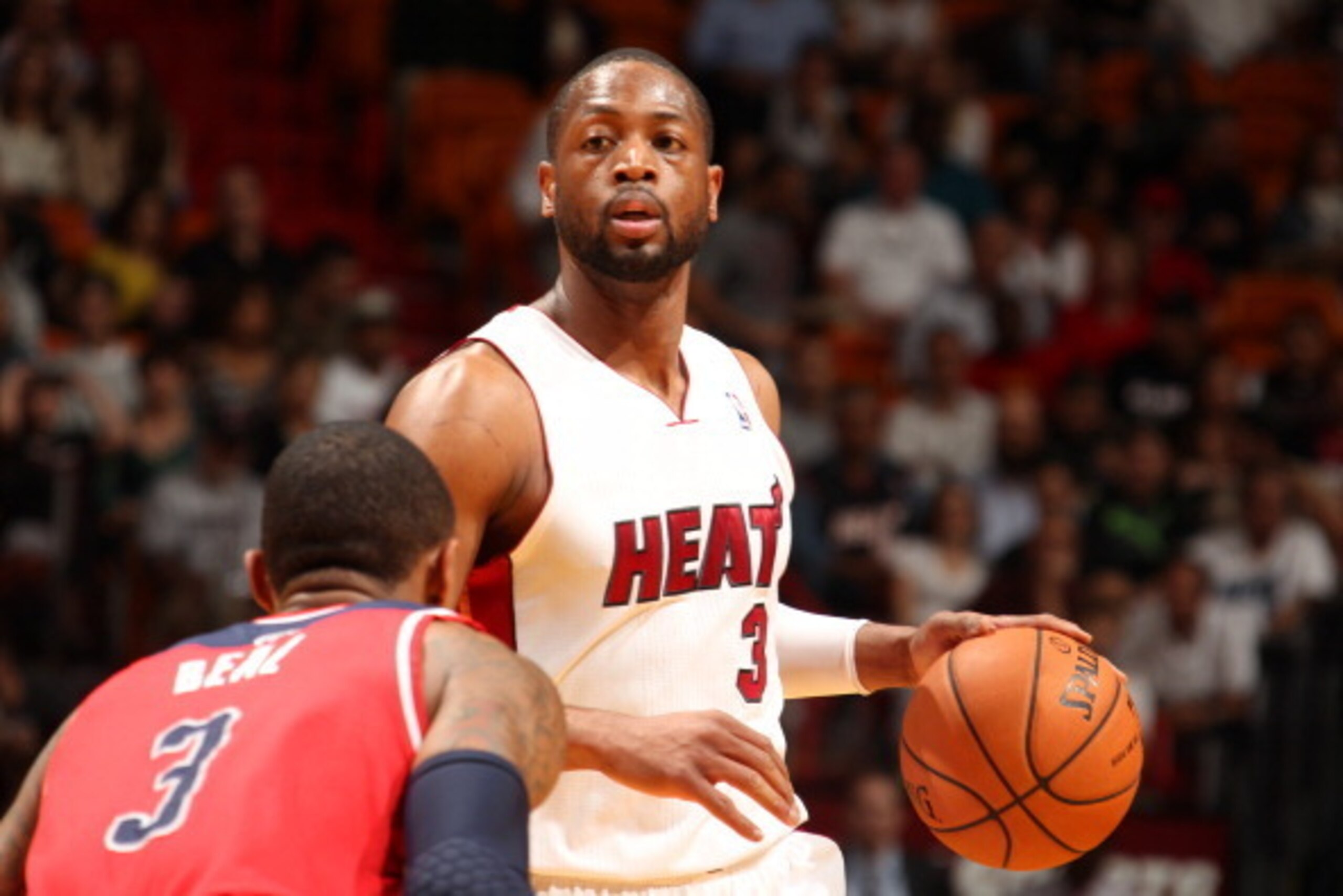 MIAMI, FL - March 10: Dwyane Wade #3 of the Miami Heat dribbles the ball against the Washington Wizards at the American Airlines Arena in Miami, Florida on March 10 2014. NOTE TO USER: User expressly acknowledges and agrees that, by downloading and/or usi