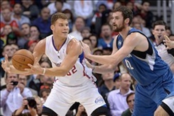 Nov 11, 2013; Los Angeles, CA, USA; Los Angeles Clippers forward Blake Griffin (32) is defended by Minnesota Timberwolves forward Kevin Love (42) at Staples Center. Mandatory Credit: Kirby Lee-USA TODAY Sports