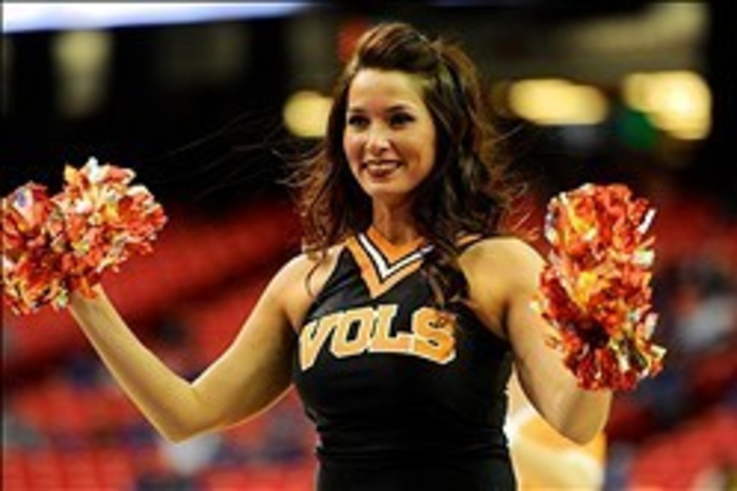Mar 14, 2014; Atlanta, GA, USA; A Tennessee Volunteers cheerleader on the court during the game against the South Carolina Gamecocks during the second half in the quarterfinals of the SEC college basketball tournament at Georgia Dome. Tennessee defeated S