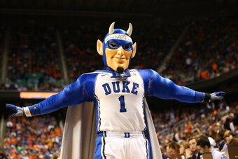 GREENSBORO, NC - MARCH 16:  The Duke Blue Devils mascot tries to rally their fans during their game against the Virginia Cavaliers in the finals of the 2014 Men's ACC Basketball Tournament at Greensboro Coliseum on March 16, 2014 in Greensboro, North Caro