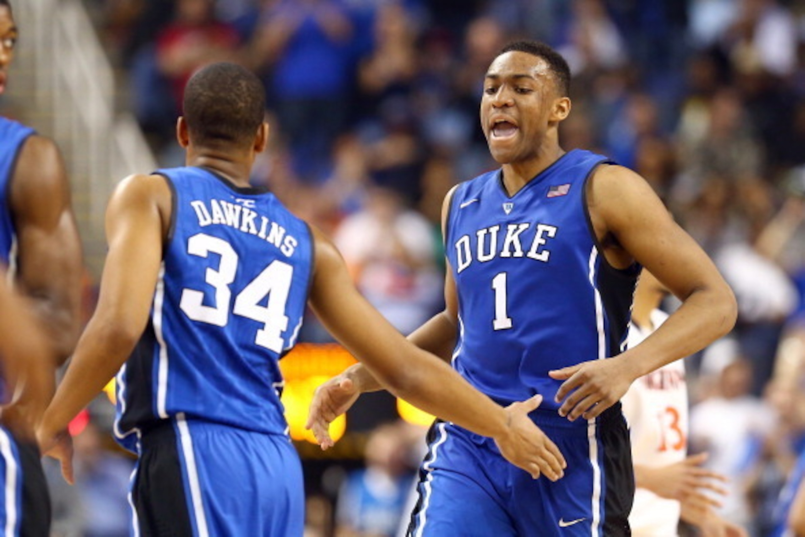 GREENSBORO, NC - MARCH 16:  Jabari Parker #1 of the Duke Blue Devils is congratulated by Andre Dawkins #34 of the Duke Blue Devils during their game against the Virginia Cavaliers in the finals of the 2014 Men's ACC Basketball Tournament at Greensboro Col