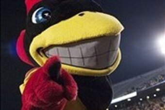 Nov 30, 2013; Morgantown, WV, USA; Iowa State Cyclones mascot celebrates after Iowa State Cyclones wide receiver Justin Coleman (80) scores a touchdown in the during the the third overtime at Milan Puskar Stadium. Iowa State Cyclones defeated West Virgini