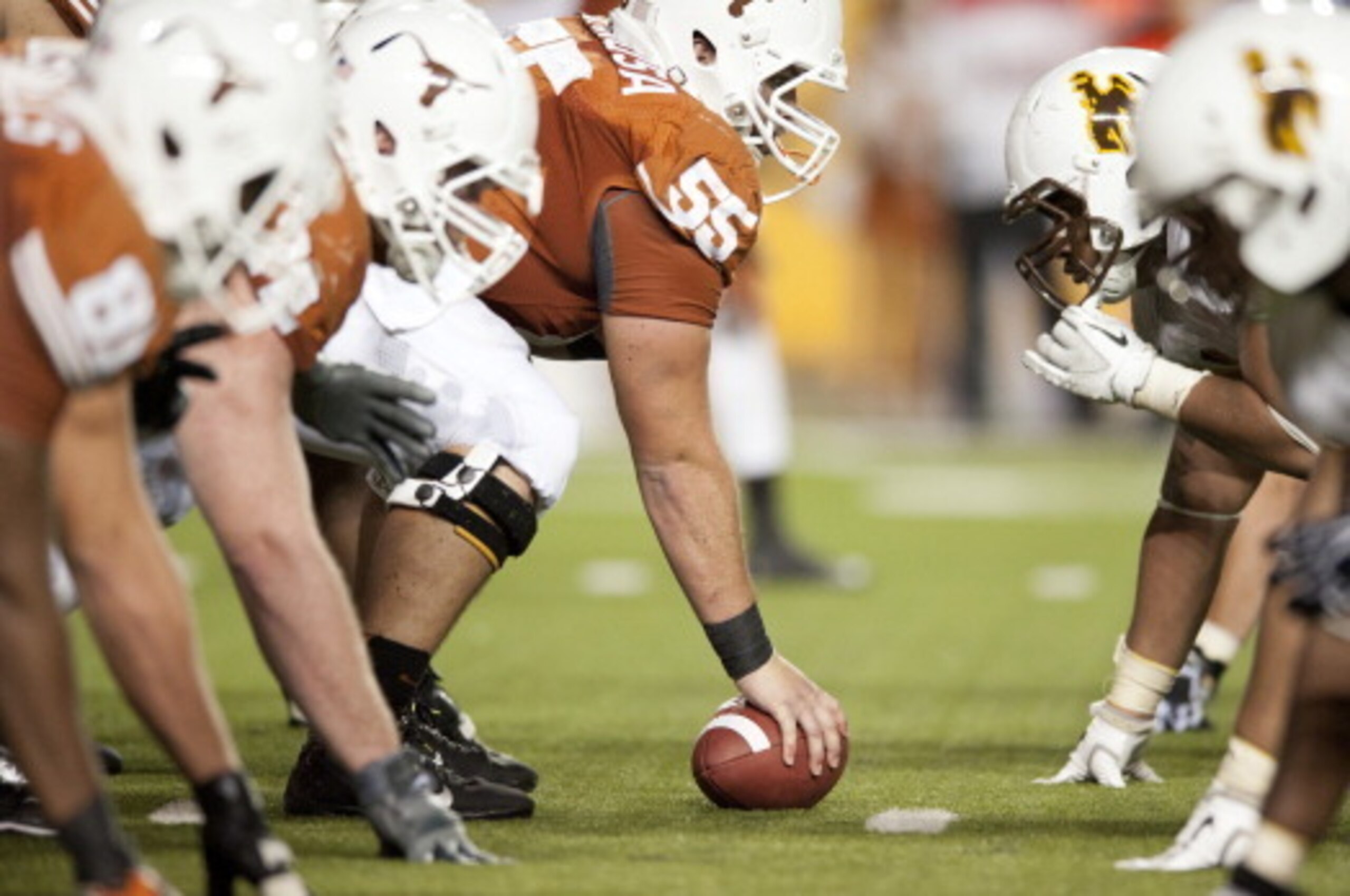 AUSTIN, TX - SEPTEMBER 1: Dominic Espinosa #55 of the Texas Longhorns lines up against the Wyoming Cowboy defense on September 1, 2012 at Darrell K Royal-Texas Memorial Stadium in Austin, Texas.  (Photo by Cooper Neill/Getty Images)