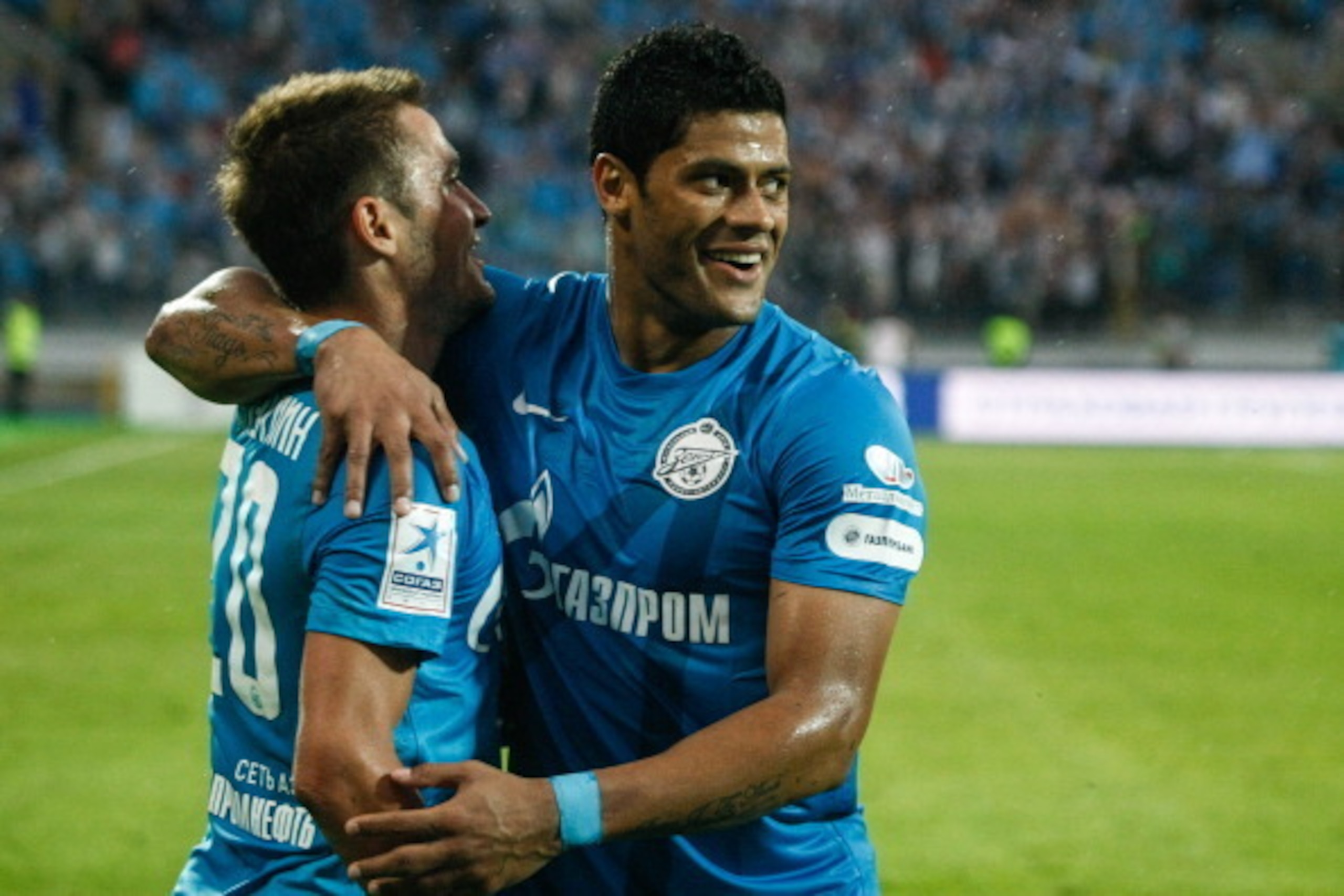 ST. PETERSBURG, RUSSIA - MAY 19: Viktor Fayzulin of FC Zenit St. Petersburg (L) and Hulk of FC Zenit St. Petersburg celebrate a goal during the Russian Premier League match between FC Zenit St. Petersburg and FC Volga Nizhny Novgorod at the Petrovsky stad