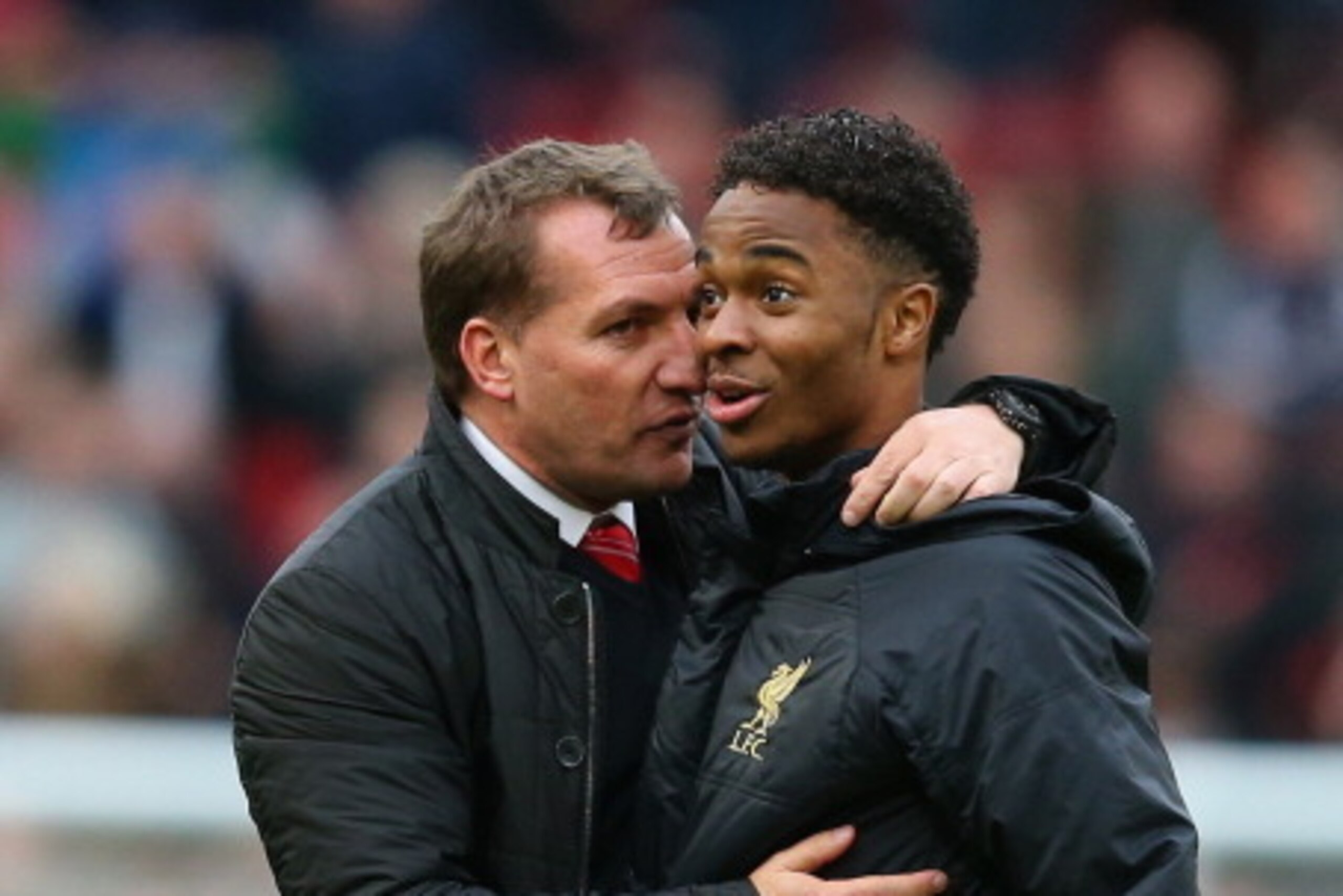 MANCHESTER, ENGLAND - MARCH 16:  Liverpool Manager Brendan Rodgers congratulates Raheem Sterling at the end of the Barclays Premier League match between Manchester United and Liverpool at Old Trafford on March 16, 2014 in Manchester, England.  (Photo by A