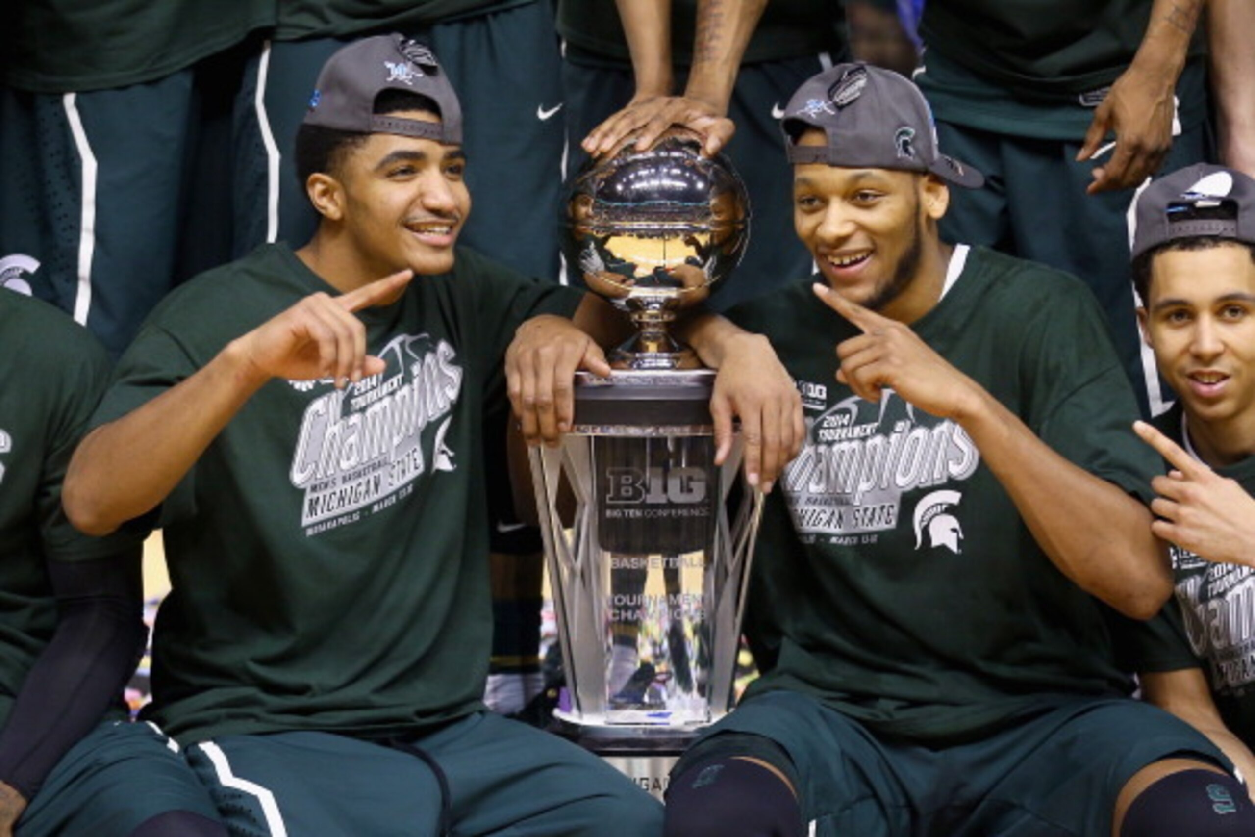 INDIANAPOLIS, IN - MARCH 16:   Gary Harris #14 and Adreian Payne #5 of the Michigan State Spartans celebrates after the 69-55 win over the Michigan Wolverines  during the finals of the Big Ten Basketball Tournament at Bankers Life Fieldhouse on March 16, 