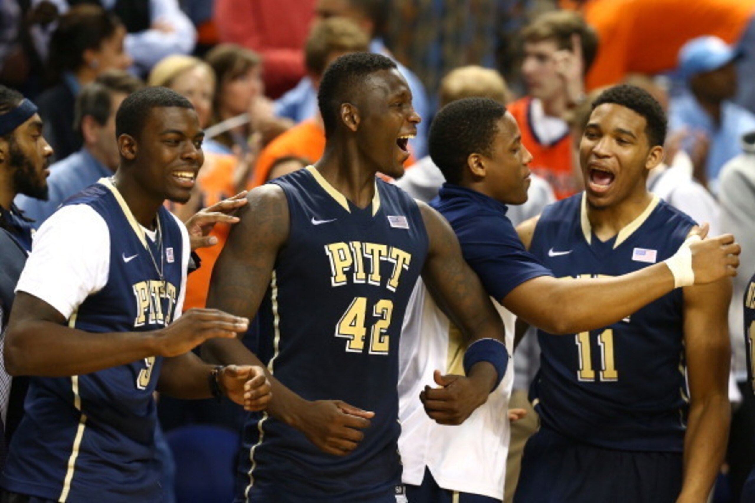 GREENSBORO, NC - MARCH 14:  Talib Zanna #42 of the Pittsburgh Panthers celebrates on the bench with teammates against the North Carolina Tar Heels during the quarterfinals of the 2014 Men's ACC Basketball Tournament at Greensboro Coliseum on March 14, 201