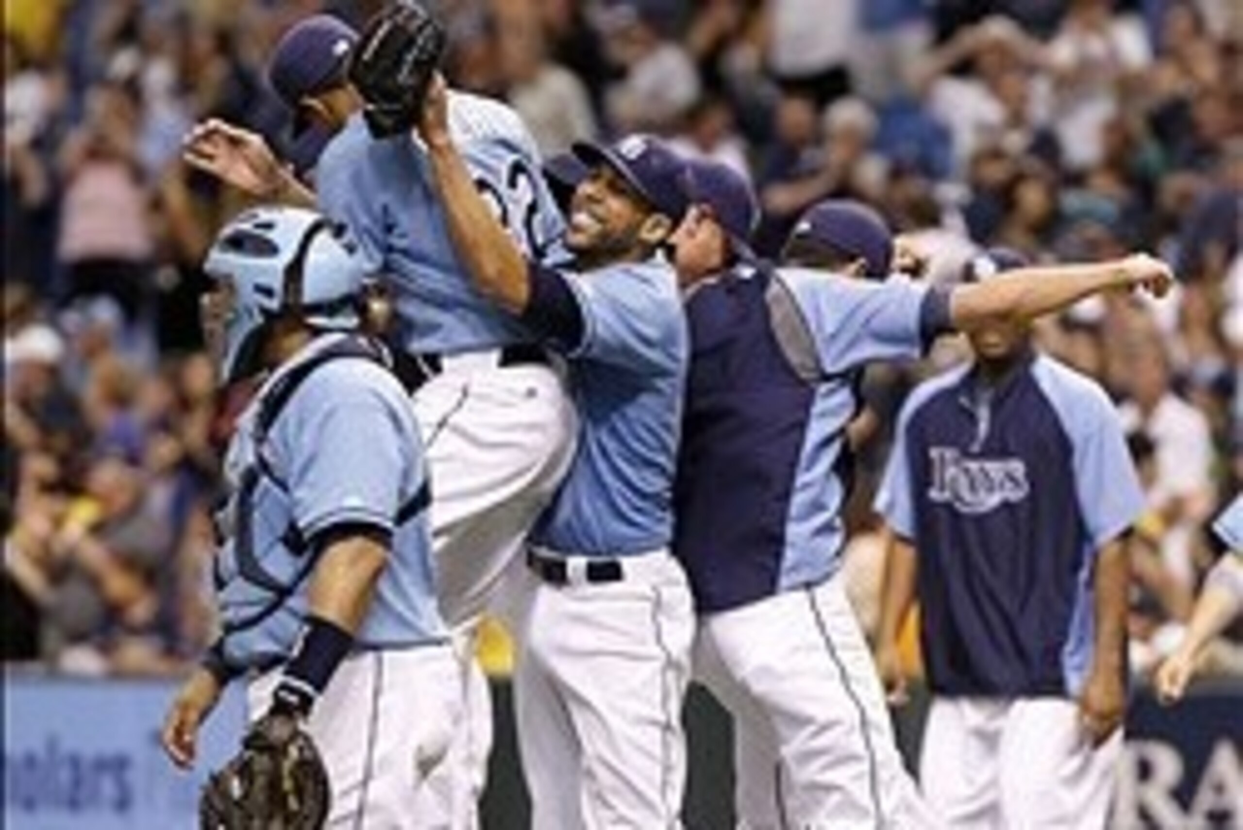 Jul 7, 2013; St. Petersburg, FL, USA; Tampa Bay Rays starting pitcher David Price (14) reacts with pitcher Chris Archer (22) after he threw a complete game against the Chicago White Sox  at Tropicana Field. Tampa Bay Rays defeated the Chicago White Sox 3-