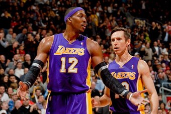 TORONTO, CANADA - JANUARY 20: Dwight Howard #12 and Steve Nash #10 of the Los Angeles Lakers speak during a game against the Toronto Raptors on January 20, 2013 at the Air Canada Centre in Toronto, Ontario, Canada.  NOTE TO USER: User expressly acknowledg