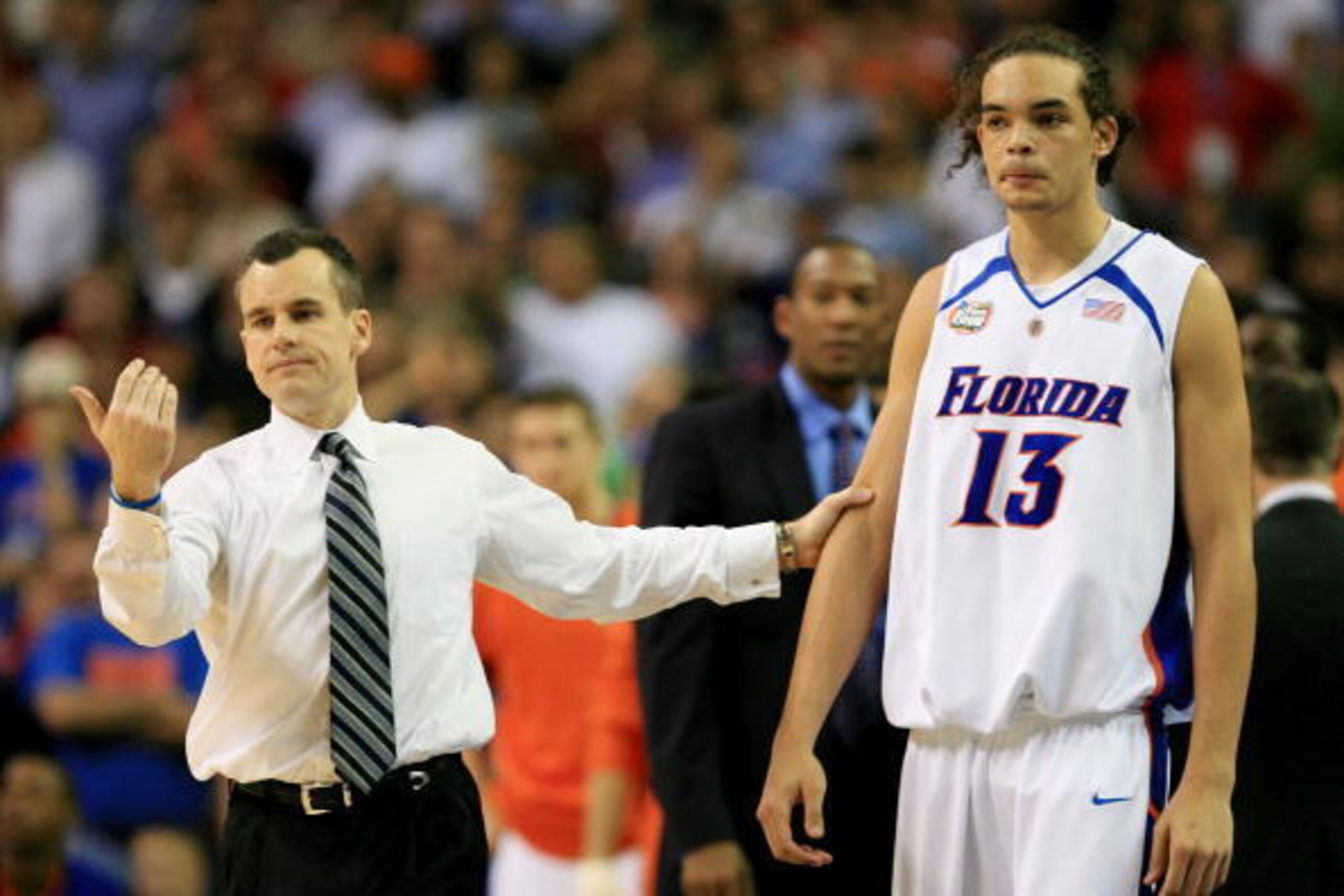ATLANTA - APRIL 02:  Head coach Billy Donovan of the Florida Gators grabs Joakim Noah #13 during their game against the Ohio State Buckeyes during the NCAA Men's Basketball Championship game at the Georgia Dome on April 2, 2007 in Atlanta, Georgia.  (Phot