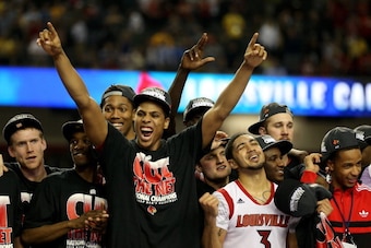 ATLANTA, GA - APRIL 08:  (L-R) Tim Henderson #15, Russ Smith #2, Wayne Blackshear #20 and Peyton Siva #3 of the Louisville Cardinals celebrate with teammates after they defeated the Michigan Wolverines during the 2013 NCAA Men's Final Four Championship at