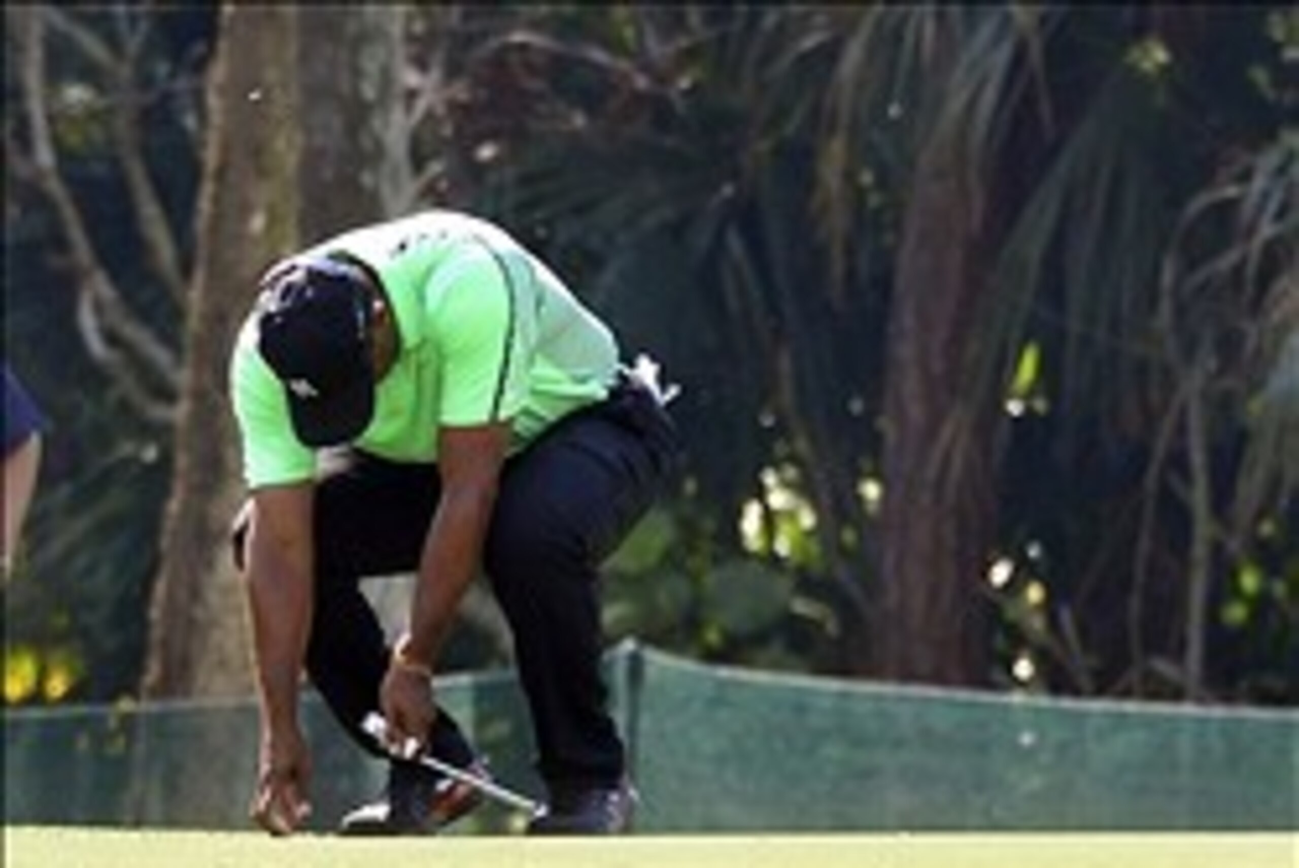 Feb 28, 2014; Palm Beach Gardens, FL, USA; Tiger Woods drops his club after a putt on the 7th green during the second round of The Honda Classic at PGA National GC Champion Course. Mandatory Credit: Bob Donnan-USA TODAY Sports Feb 28, 2014; Palm Beach Gardens, FL, USA; Tiger Woods drops his club after a putt on the 7th green during the second round of The Honda Classic at PGA National GC Champion Course. Mandatory Credit: Bob Donnan-USA TODAY Sports