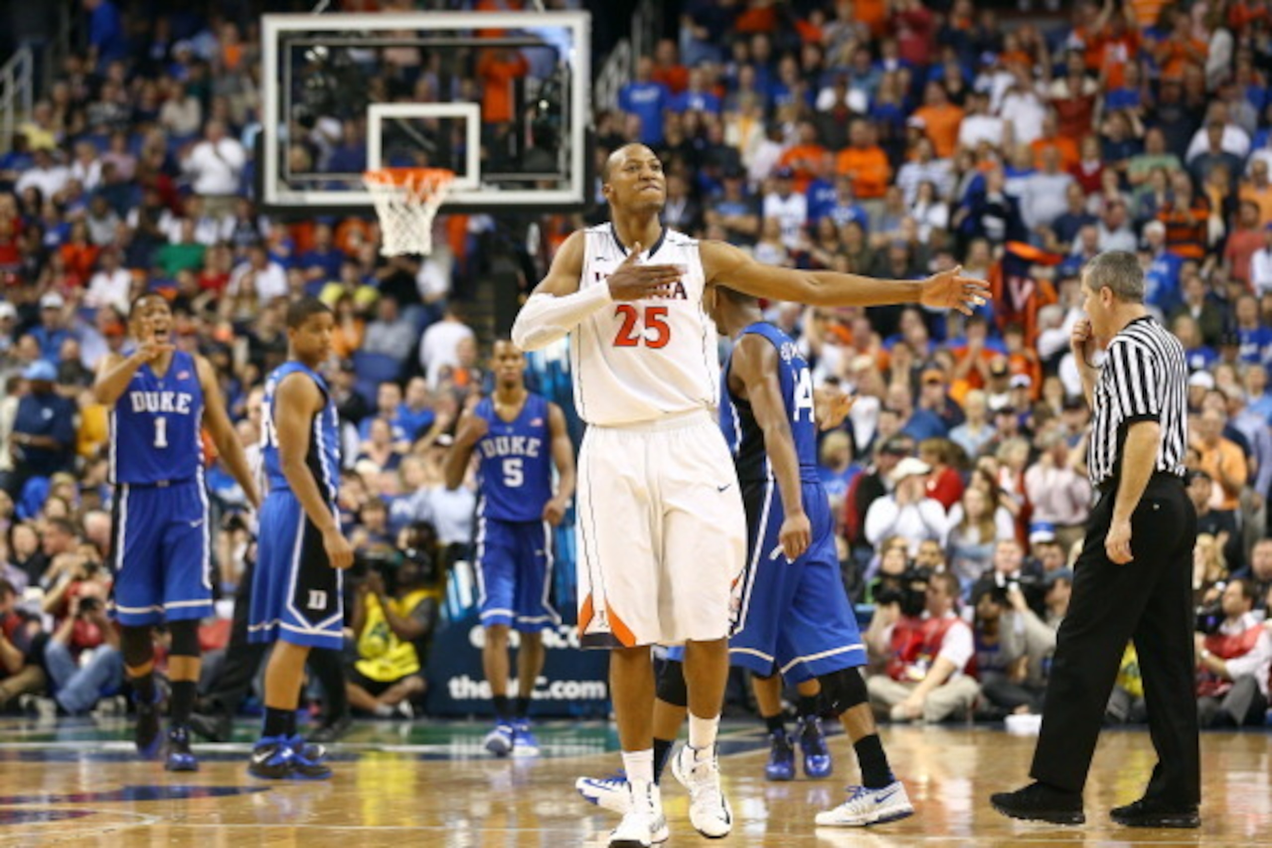 GREENSBORO, NC - MARCH 16:  Akil Mitchell #25 of the Virginia Cavaliers reacts during the final minutes of their victory over the Duke Blue Devils in the finals of the 2014 Men's ACC Basketball Tournament at Greensboro Coliseum on March 16, 2014 in Greens