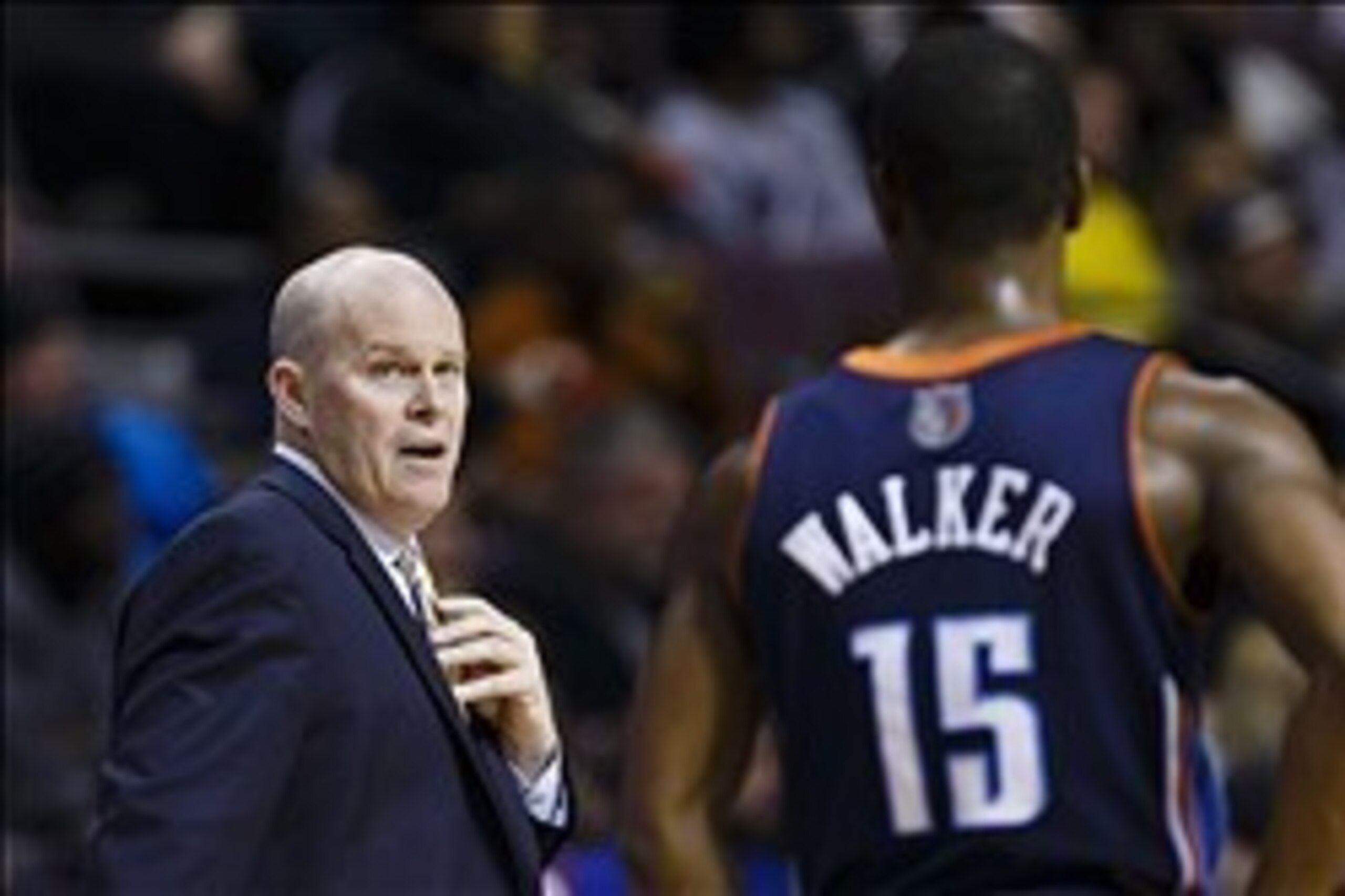Feb 18, 2014; Auburn Hills, MI, USA; Charlotte Bobcats head coach Steve Clifford talks to point guard Kemba Walker (15) in the fourth quarter against the Detroit Pistons at The Palace of Auburn Hills. Charlotte won 108-96. Mandatory Credit: Rick Osentoski