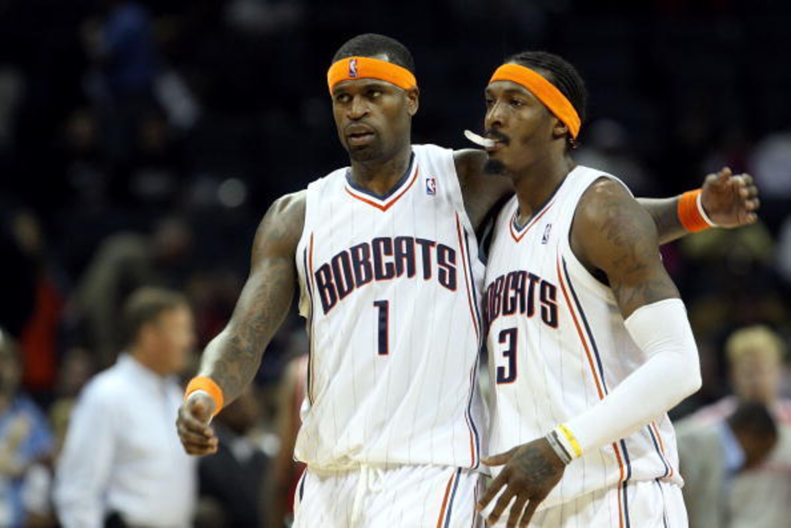 CHARLOTTE, NC - JANUARY 12:  Teammates Stephen Jackson #1 and Gerald Wallace #3 of the Charlotte Bobcats celebrate after a 102-94 victory over the Houston Rockets at Time Warner Cable Arena on January 12, 2010 in Charlotte, North Carolina.  NOTE TO USER: 