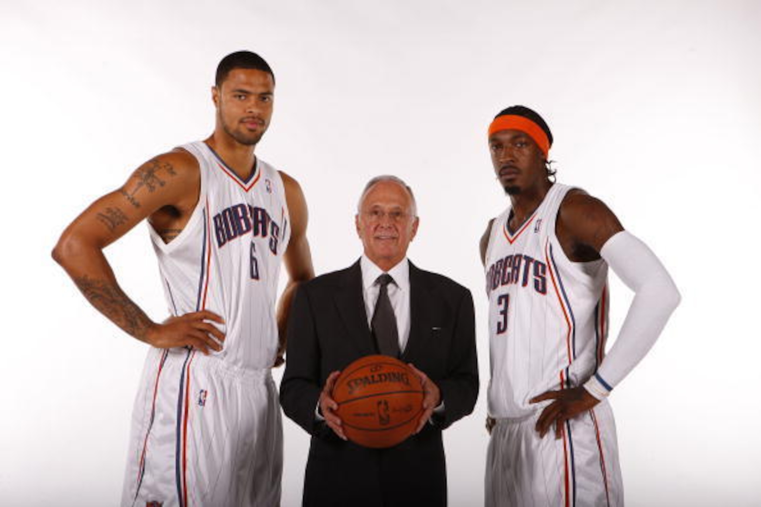 CHARLOTTE, NC - SEPTEMBER 28:  Tyson Chandler #6, Gerald Wallace #3 and Head Coach Larry Brown of the Charlotte Bobcats pose for a portrait during 2009 NBA Media Day on September 28, 2009 at Time Warner Cable Arena in Charlotte, North Carolina.  NOTE TO U
