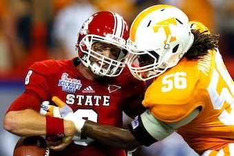 ATLANTA, GA - AUGUST 31:  Curt Maggitt #56 of the Tennessee Volunteers strips the ball from Mike Glennon #8 of the North Carolina State Wolfpack at Georgia Dome on August 31, 2012 in Atlanta, Georgia.  (Photo by Kevin C. Cox/Getty Images)