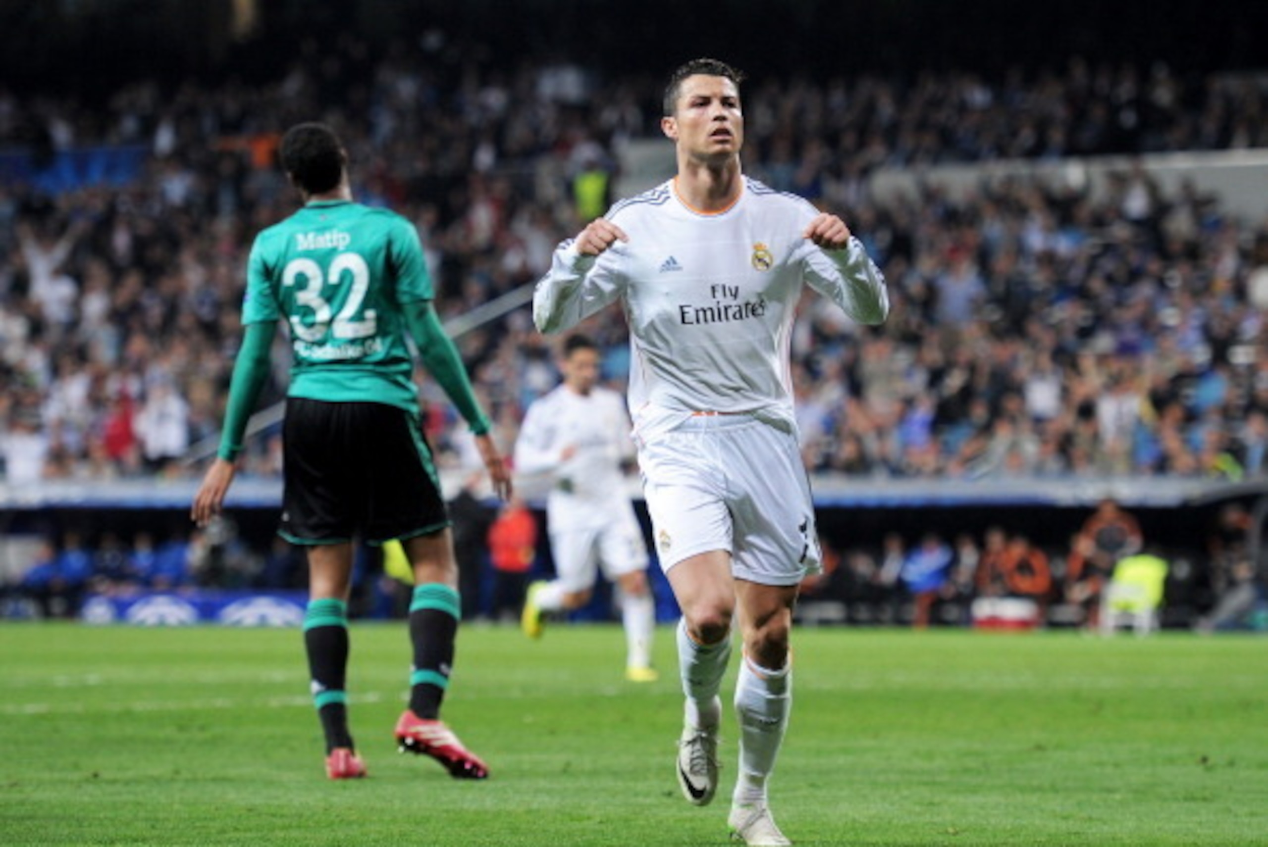 MADRID, SPAIN - MARCH 18:  Cristiano Ronaldo of Real Madrid celebrates after scoring his team's second goal during the UEFA Champions League Round of 16, second leg match between Real Madrid and FC Schalke 04 at Estadio Santiago Bernabeu on March 18, 2014
