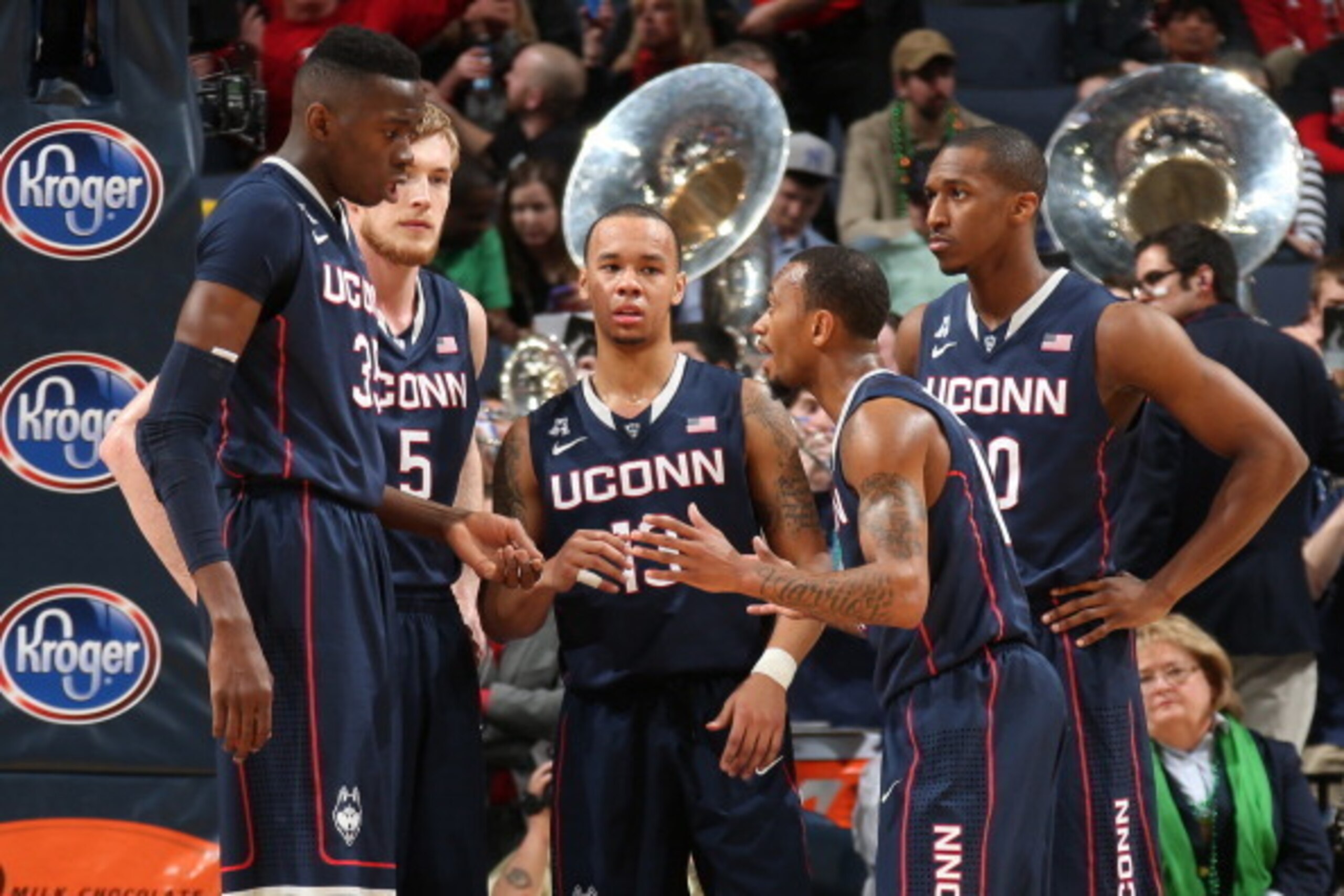 MEMPHIS, TN - MARCH 15: Amida Brimah #35, Niels Giffey #5, Shabazz Napier #13, Ryan Boatright #11 and Lasan Kromah #20 of the Connecticut Huskies huddle together against the Louisville Cardinals during the Championship of the American Athletic Conference 