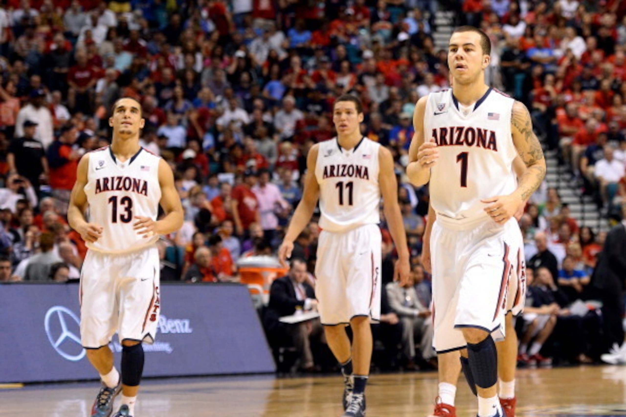 LAS VEGAS, NV - MARCH 15:  Nick Johnson #13, Aaron Gordon #11 and Gabe York #1 of the Arizona Wildcats walk on the court during the championship game of the Pac-12 Basketball Tournament against the UCLA Bruins at the MGM Grand Garden Arena on March 15, 20