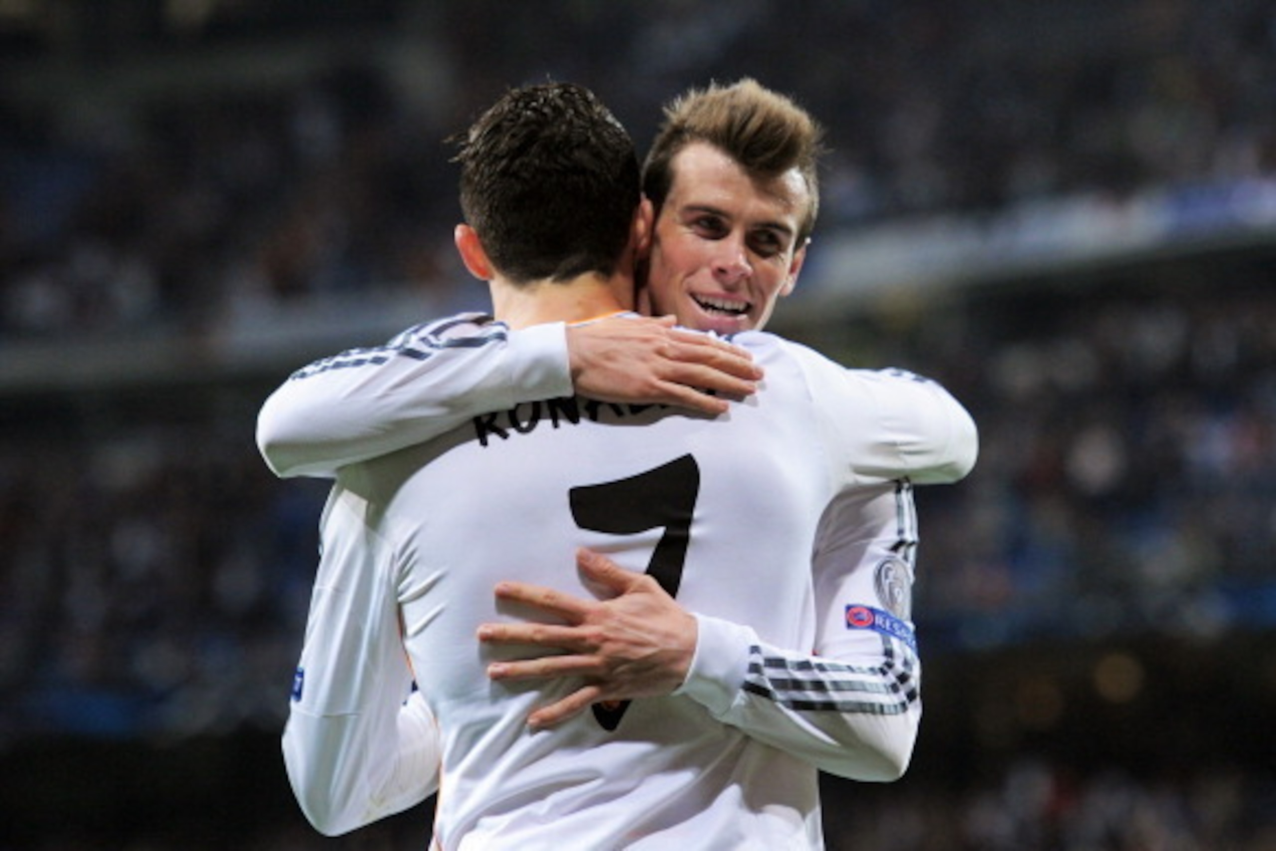 MADRID, SPAIN - MARCH 18:  Cristiano Ronaldo of Real Madrid celebrates with teammate Gareth Bale after scoring his team's second goal during the UEFA Champions League Round of 16, second leg match between Real Madrid and FC Schalke 04 at Estadio Santiago 