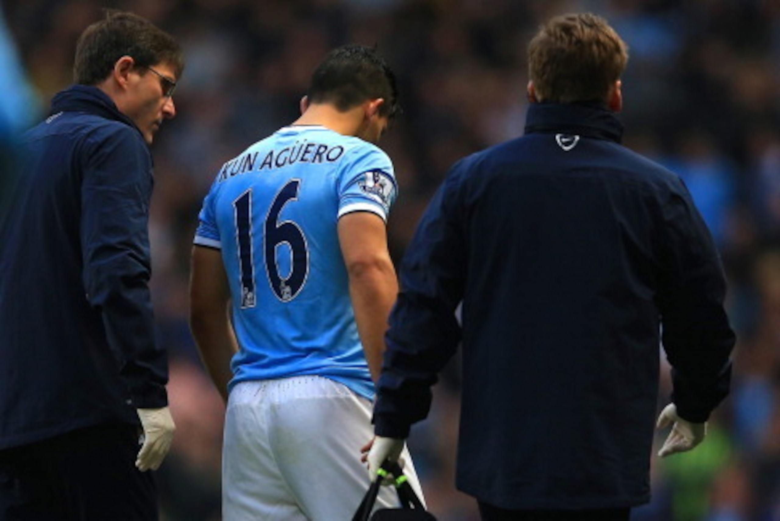 MANCHESTER, ENGLAND - DECEMBER 14: Sergio Aguero of Manchester City receives treatment during the Barclays Premier League match between Manchester City and Arsenal at Etihad Stadium on December 14, 2013 in Manchester, England. (Photo by Richard Heathcote/