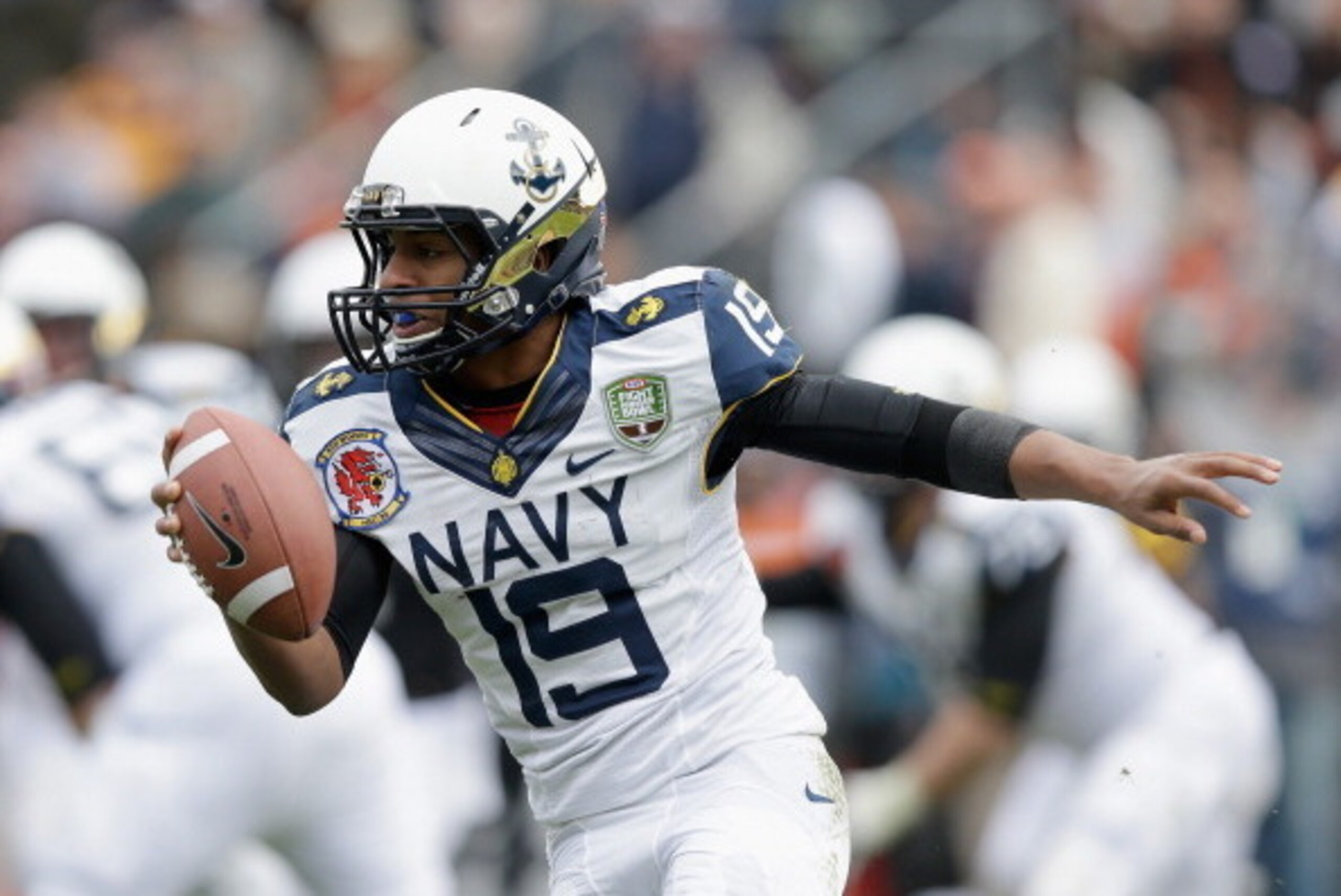 SAN FRANCISCO, CA - DECEMBER 29:  Keenan Reynolds #19 of the Navy Midshipmen scrammbles with the ball against the Arizona State Sun Devils during the Kraft Fight Hunger Bowl at AT&T Park on December 29, 2012 in San Francisco, California.  (Photo by Ezra S