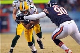 Dec 29, 2013; Chicago, IL, USA; Green Bay Packers wide receiver Jarrett Boykin (11) is pursued by Chicago Bears defensive end Julius Peppers (90) during the first quarter at Soldier Field. Mandatory Credit: Dennis Wierzbicki-USA TODAY Sports Dec 29, 2013; Chicago, IL, USA; Green Bay Packers wide receiver Jarrett Boykin (11) is pursued by Chicago Bears defensive end Julius Peppers (90) during the first quarter at Soldier Field. Mandatory Credit: Dennis Wierzbicki-USA TODAY Sports