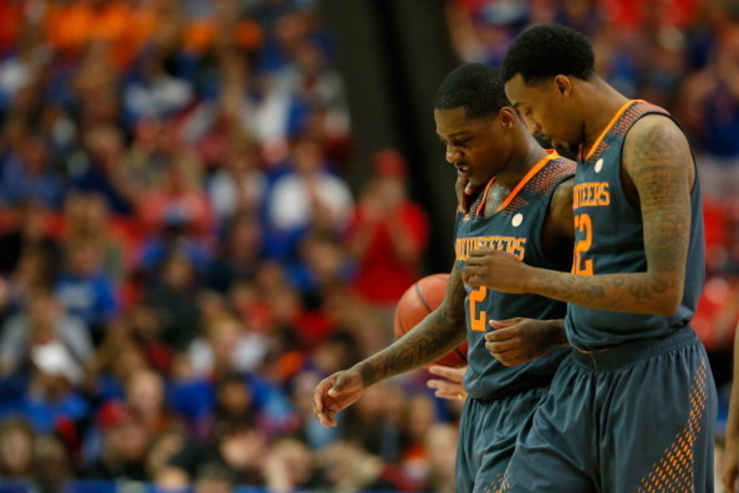 ATLANTA, GA - MARCH 15:  Antonio Barton #2 and Jordan McRae #52 of the Tennessee Volunteers walk of the court after a foul commited by Barton against the Florida Gators  during the semifinals of the SEC Men's Basketball Tournament at Georgia Dome on March