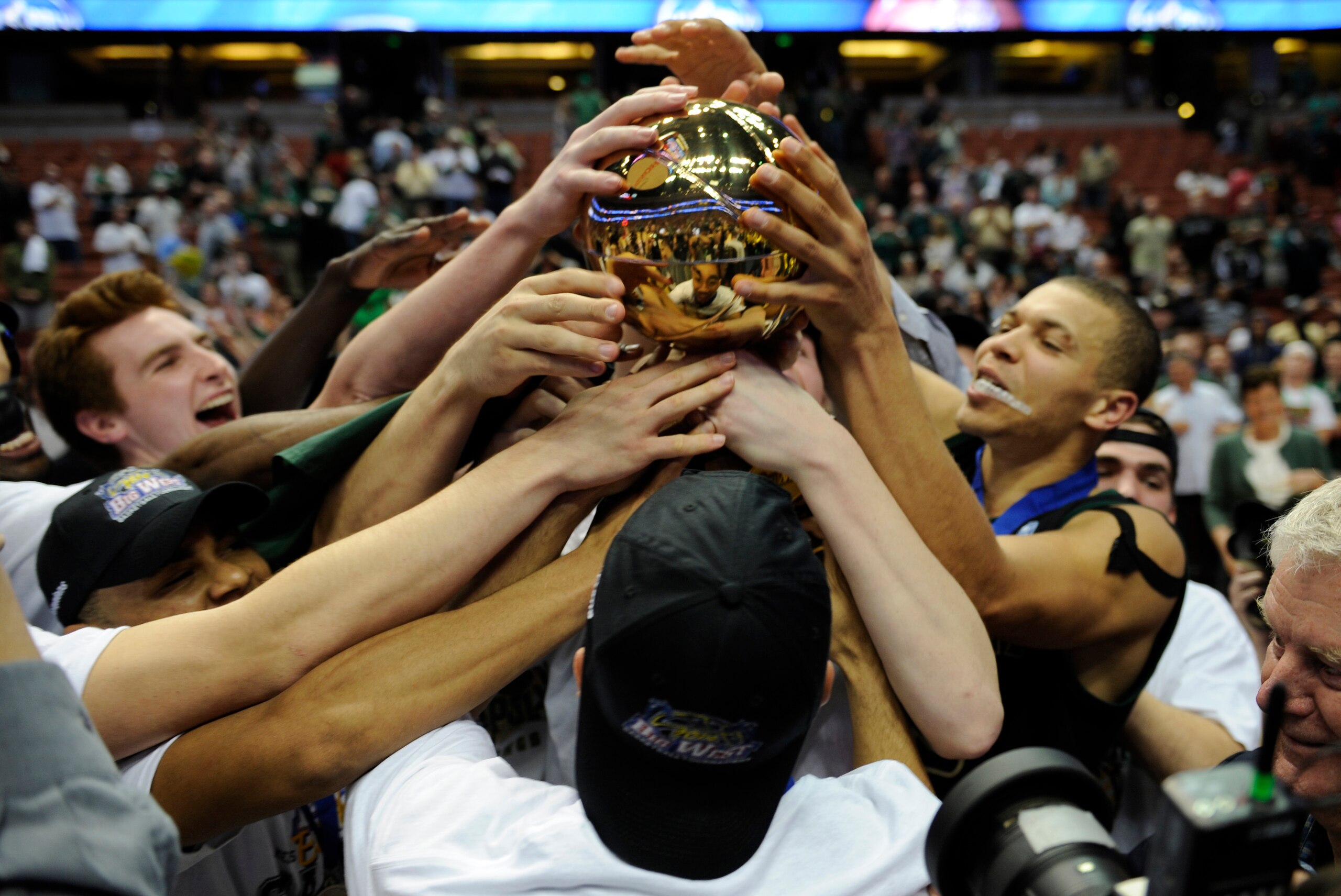 Mar 15, 2014; Anaheim, CA, USA; Cal Poly Mustangs players celebrate after their game against the Cal State Northridge Matadors in the championship game of the Big West Conference college basketball tournament at Honda Center. The Mustangs won 61-59. Manda