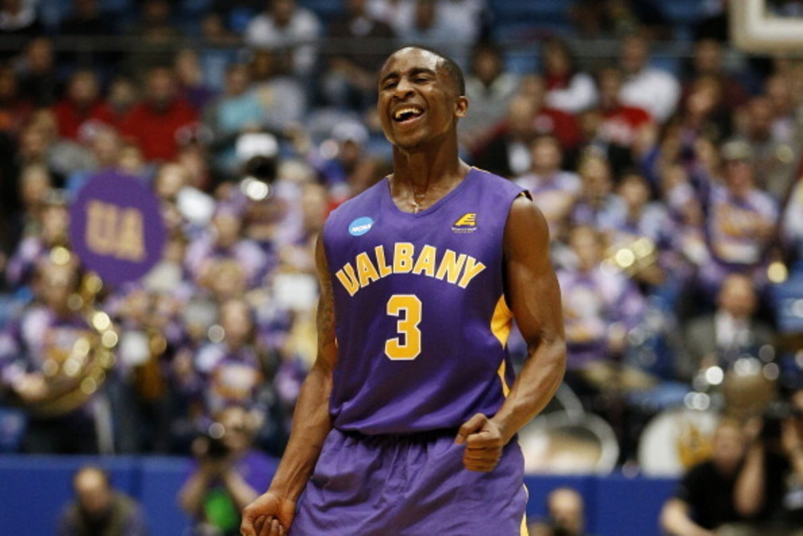 DAYTON, OH - MARCH 18:  DJ Evans #3 of the Albany Great Danes celebrates their 71 to 64 win over the Mount St. Mary's Mountaineers during the first round of the 2014 NCAA Men's Basketball Tournament at at University of Dayton Arena on March 18, 2014 in Da
