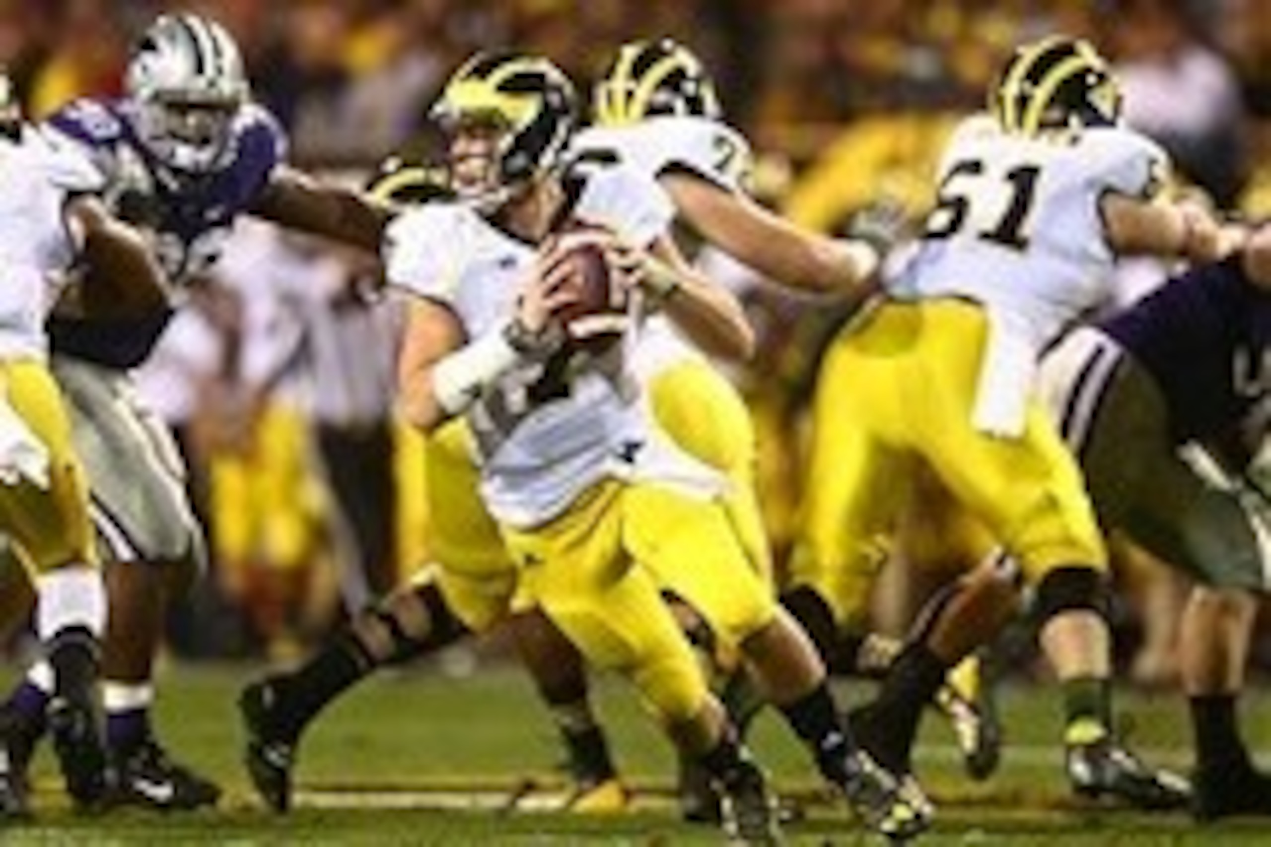 Dec 28, 2013; Tempe, AZ, USA; Michigan Wolverines quarterback Shane Morris (7) scrambles in the first half against the Kansas State Wildcats during the Buffalo Wild Wings Bowl at Sun Devil Stadium. Mandatory Credit: Mark J. Rebilas-USA TODAY Sports