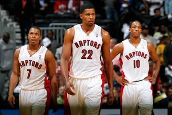 ATLANTA, GA - NOVEMBER 01:  Rudy Gay #22, Kyle Lowry #7 and DeMar DeRozan #10 of the Toronto Raptors react in the final seconds of their 102-95 loss to the Atlanta Hawks at Philips Arena on November 1, 2013 in Atlanta, Georgia.  NOTE TO USER: User express