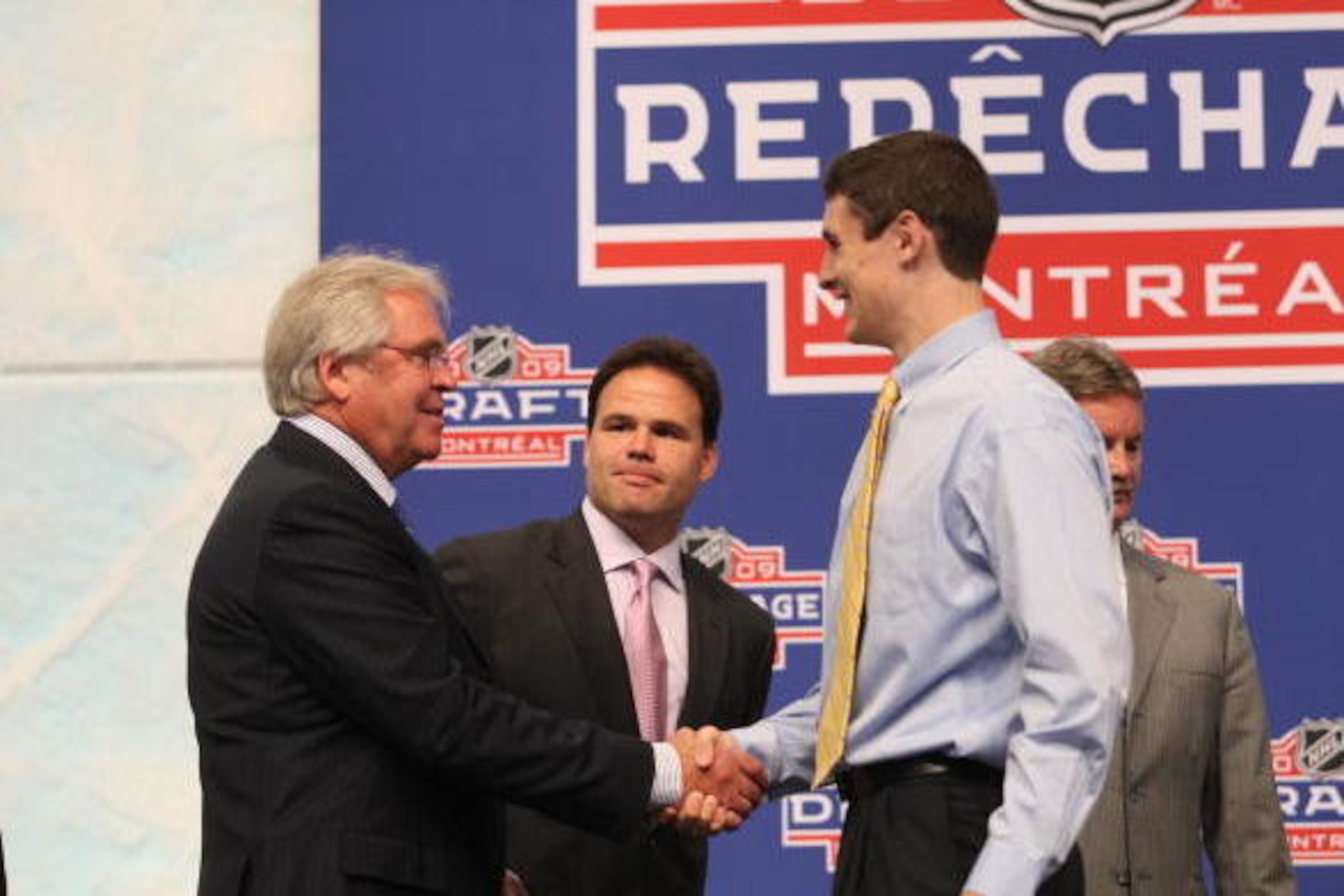 MONTREAL - JUNE 26:  President & GM Glen Sather of the New York Rangers shakes hands with draft pick Chris Kreider while Professional Scout Jeff Gorton looks on during the first round of the 2009 NHL Entry Draft at the Bell Centre on June 26, 2009 in Mont