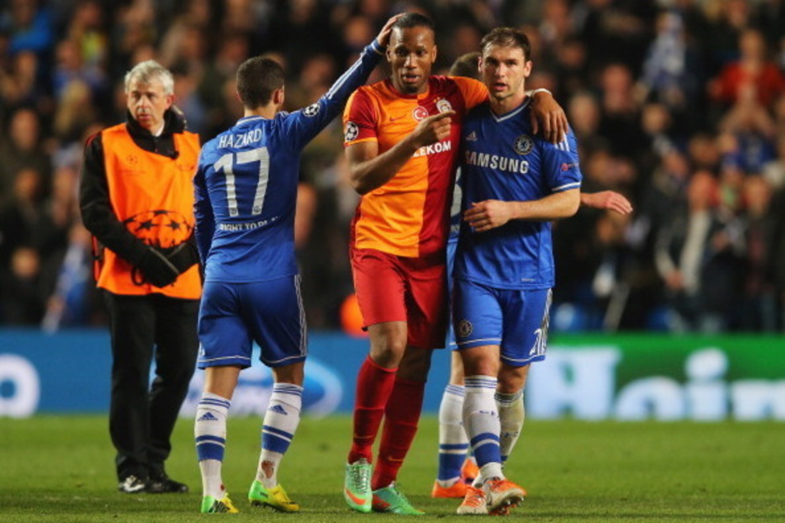 LONDON, ENGLAND - MARCH 18:  Didier Drogba of Galatasaray shakes hands with Eden Hazard (17) and Branislav Ivanovic of Chelsea (2) after the UEFA Champions League Round of 16 second leg match between Chelsea and Galatasaray AS at Stamford Bridge on March 