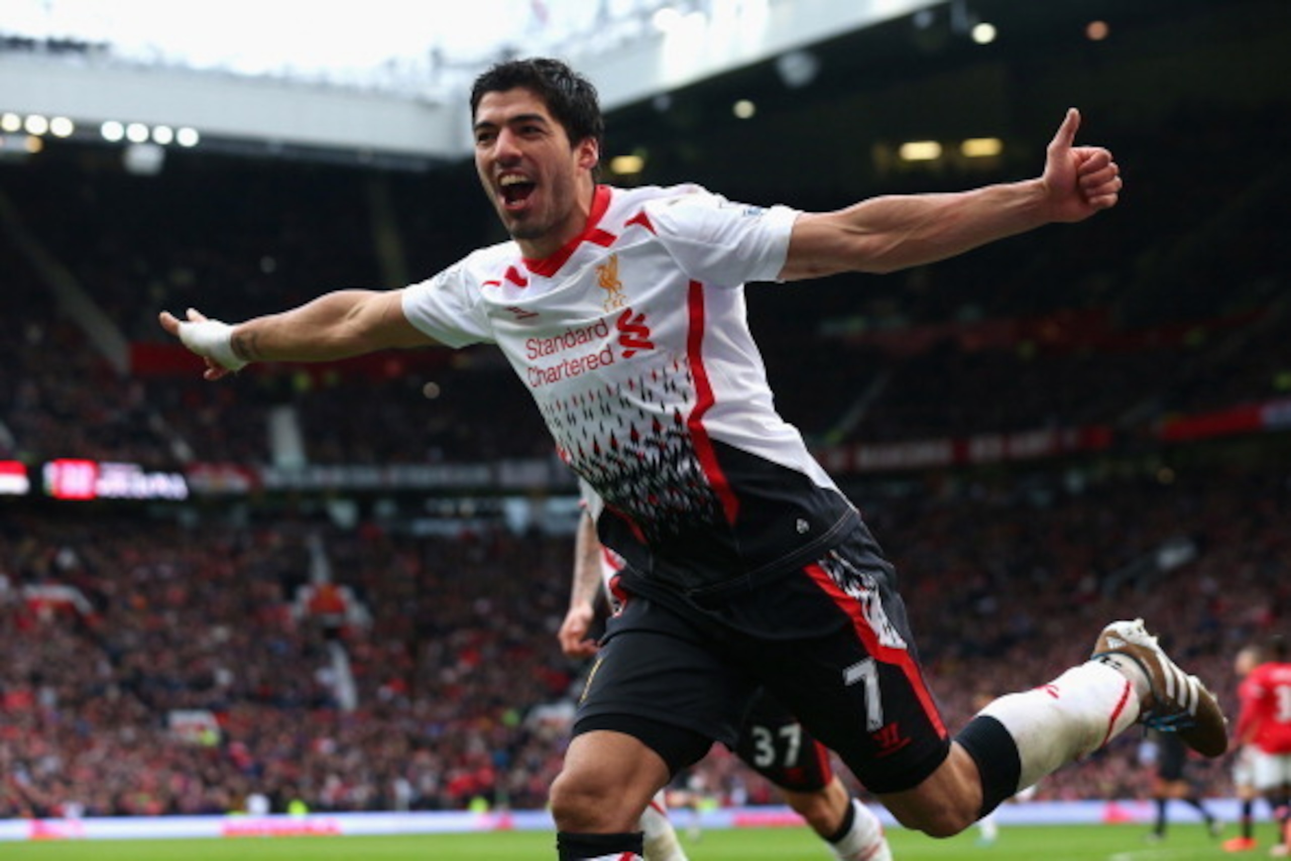 MANCHESTER, ENGLAND - MARCH 16:  Luis Suarez of Liverpool celebrates scoring his team's third goal during the Barclays Premier League match between Manchester United and Liverpool at Old Trafford on March 16, 2014 in Manchester, England.  (Photo by Alex L