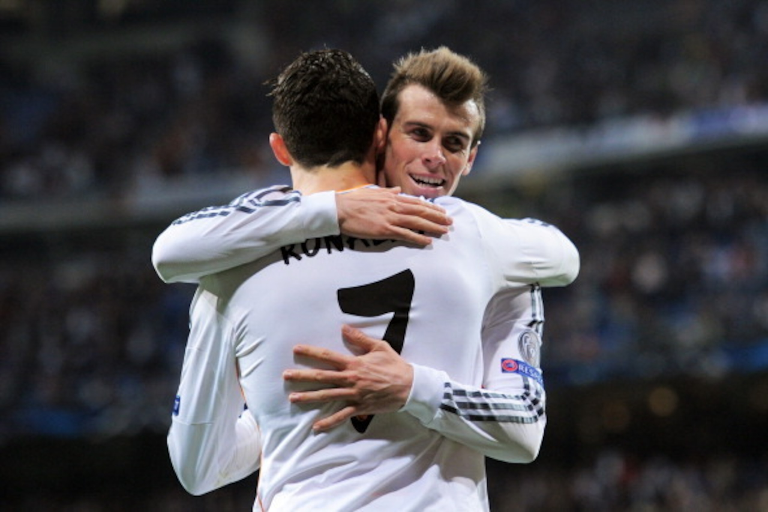 MADRID, SPAIN - MARCH 18:  Cristiano Ronaldo of Real Madrid celebrates with teammate Gareth Bale after scoring his team's second goal during the UEFA Champions League Round of 16, second leg match between Real Madrid and FC Schalke 04 at Estadio Santiago 