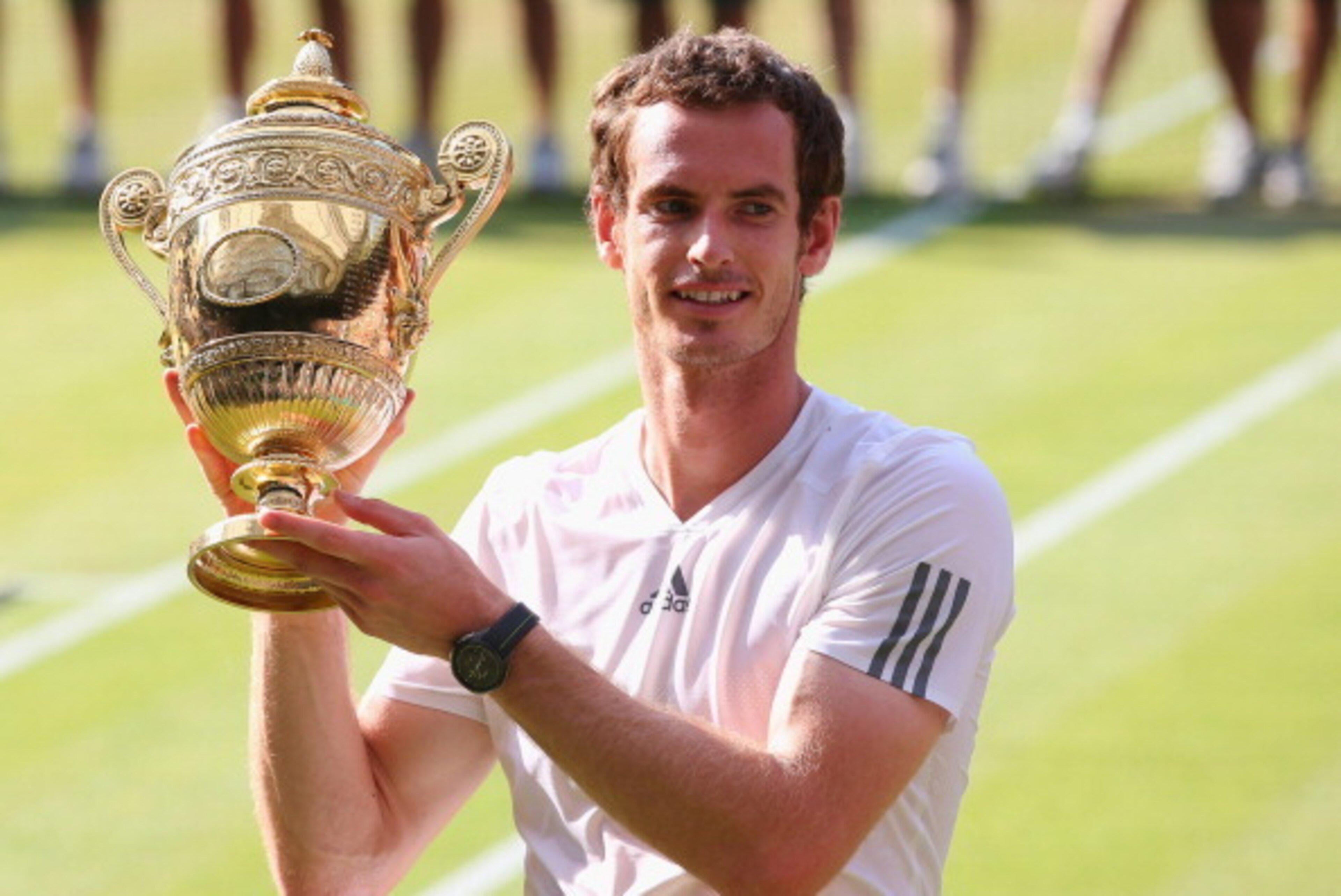 LONDON, ENGLAND - JULY 07:  Andy Murray of Great Britain poses with the Gentlemen's Singles Trophy following his victory in the Gentlemen's Singles Final match against Novak Djokovic of Serbia on day thirteen of the Wimbledon Lawn Tennis Championships at 