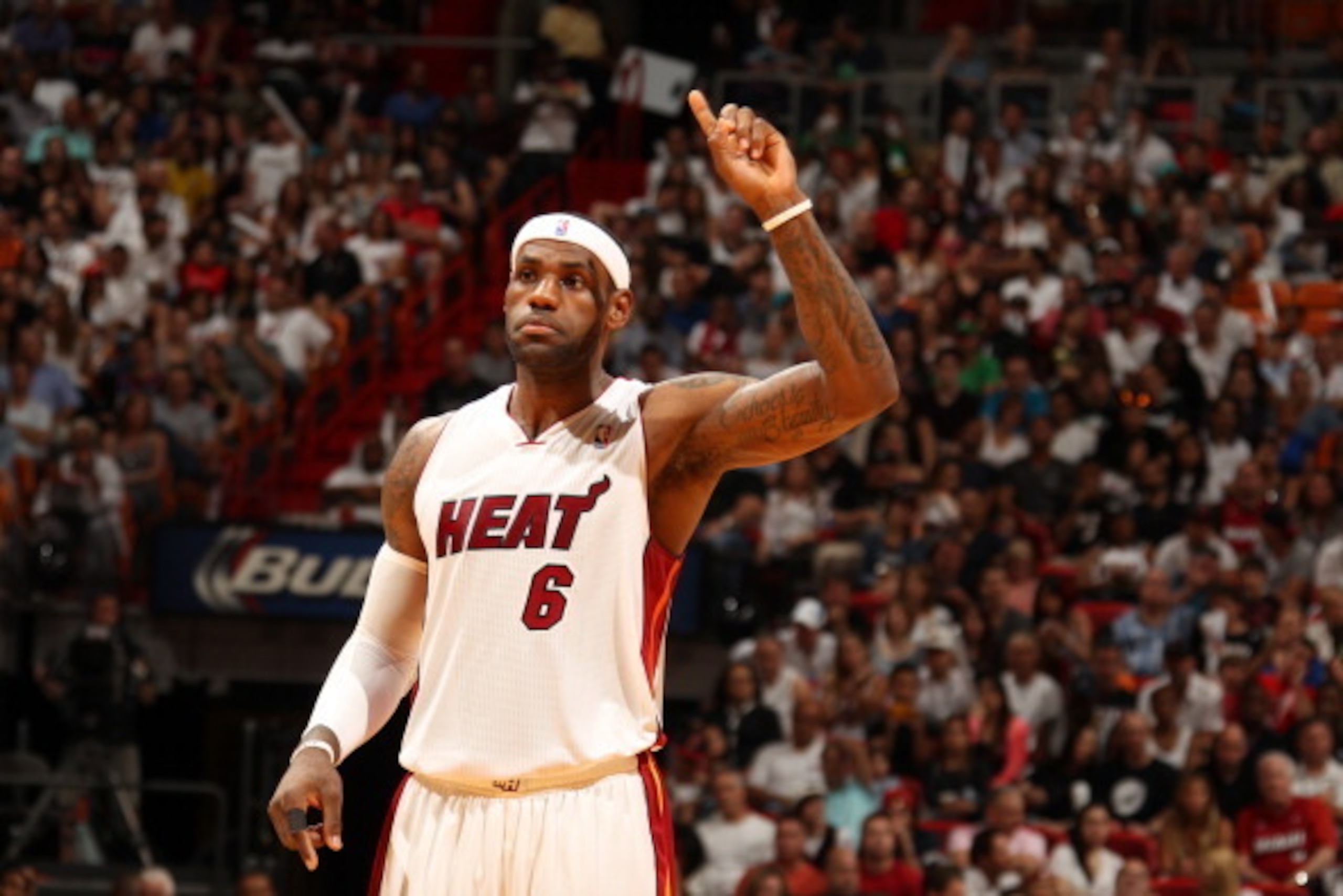MIAMI, FL - March 16: LeBron James #6 of the Miami Heat looks on against the Houston Rockets at the American Airlines Arena in Miami, Florida on March 16 2014. NOTE TO USER: User expressly acknowledges and agrees that, by downloading and/or using this pho