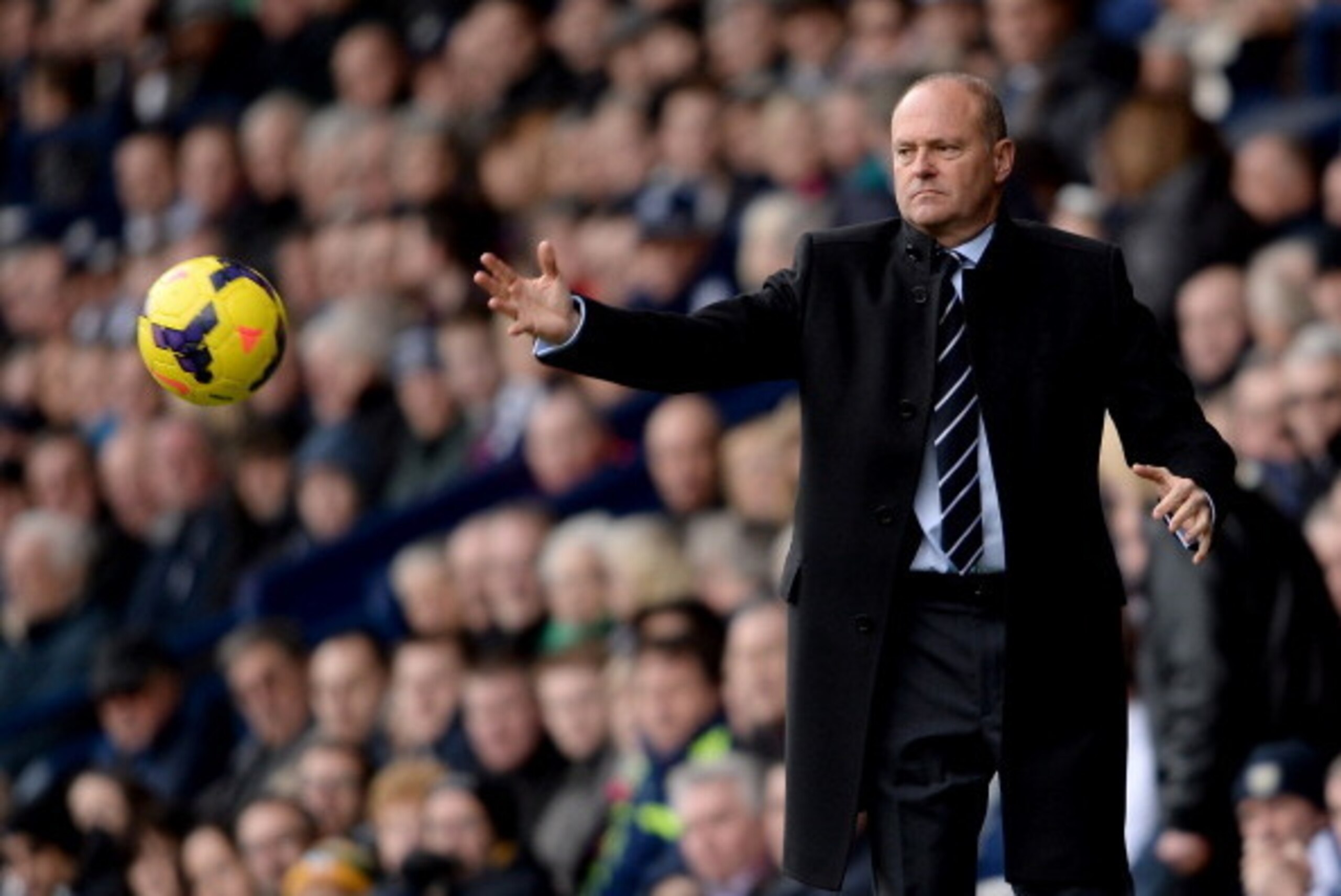 WEST BROMWICH, ENGLAND - FEBRUARY 22:  Pepe Mel the mamager of West Brom passes the ball back during the Barclays Premier League match between West Bromwich Albion and Fulham at The Hawthorns on February 22, 2014 in West Bromwich, England.  (Photo by Ross